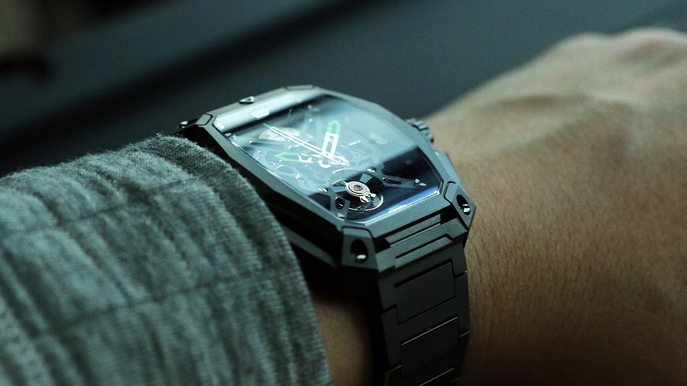 a ciga design skeleton watch on a mans wrist