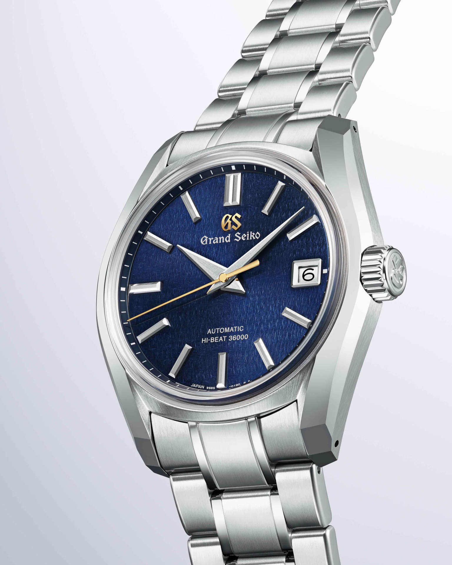 a steel watch with a blue dial