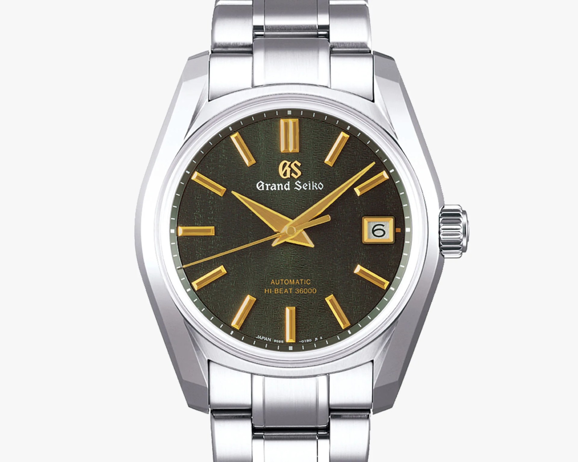 a steel watch with a green dial