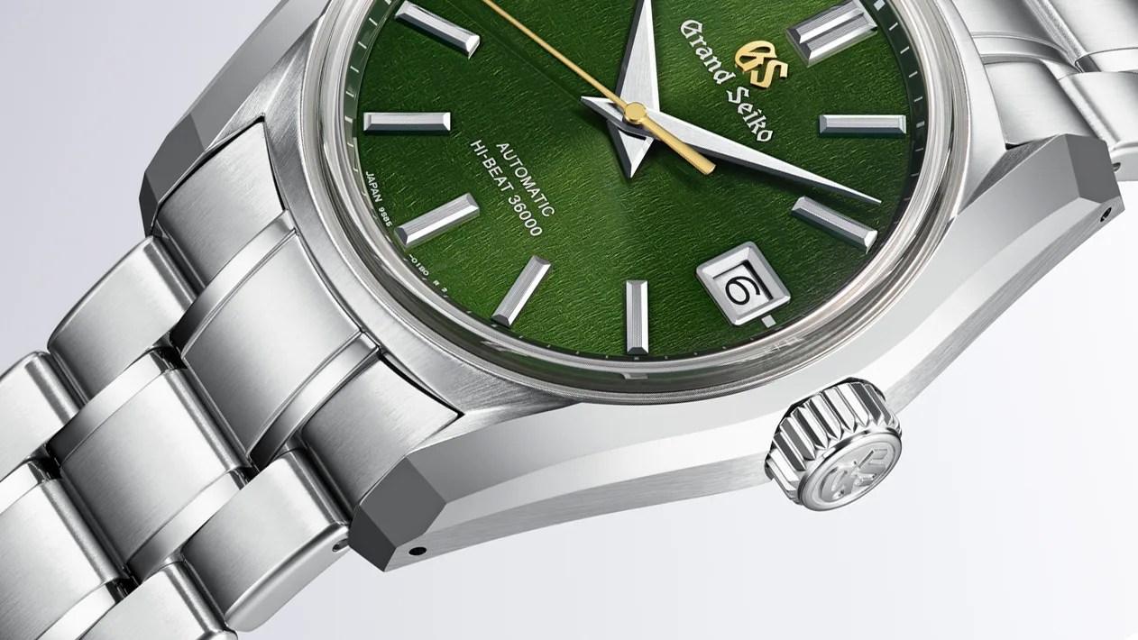 close up of a steel Grand Seiko SBGH351 Rikki watch with a green dial