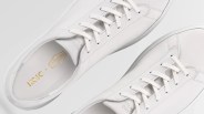 a pair of white sneakers from the top