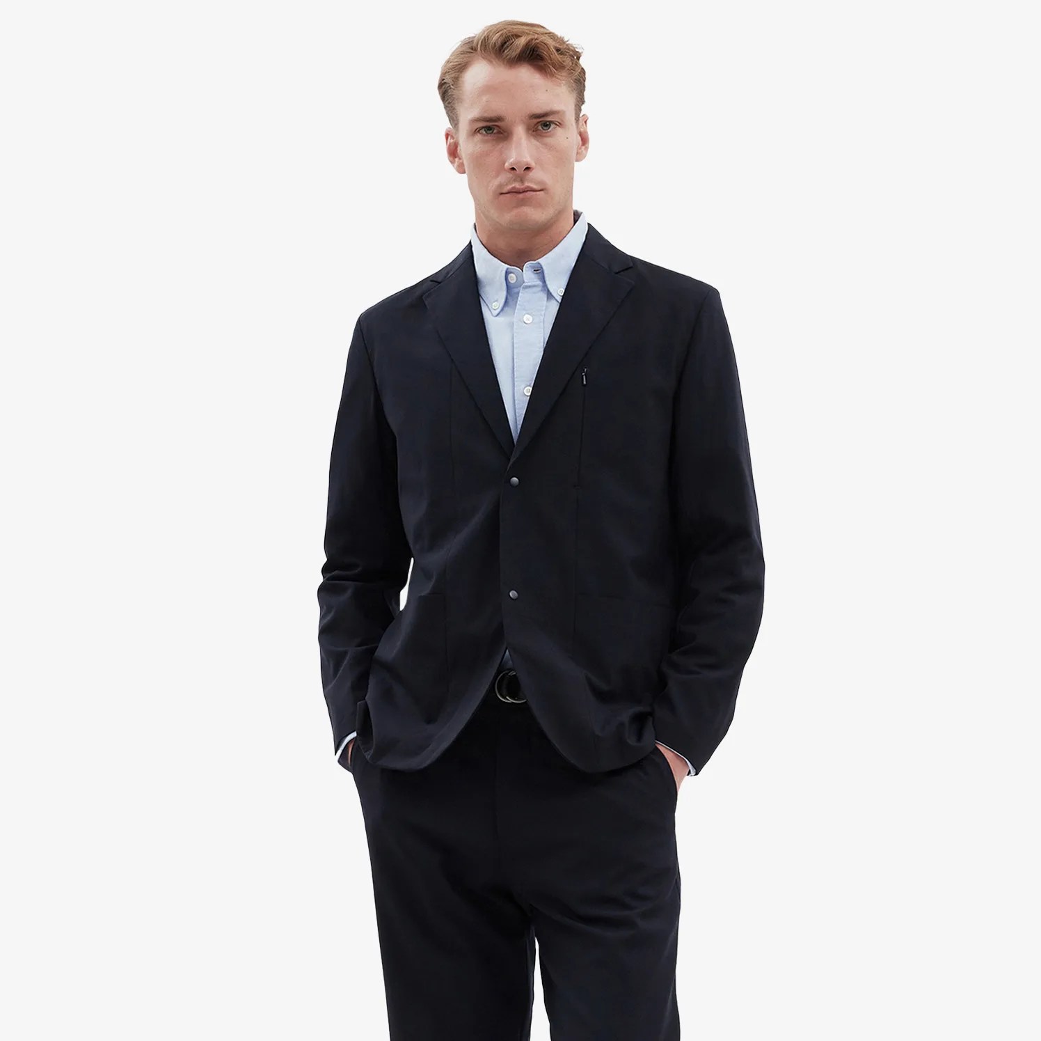 a man in a navy suit and light blue shirt