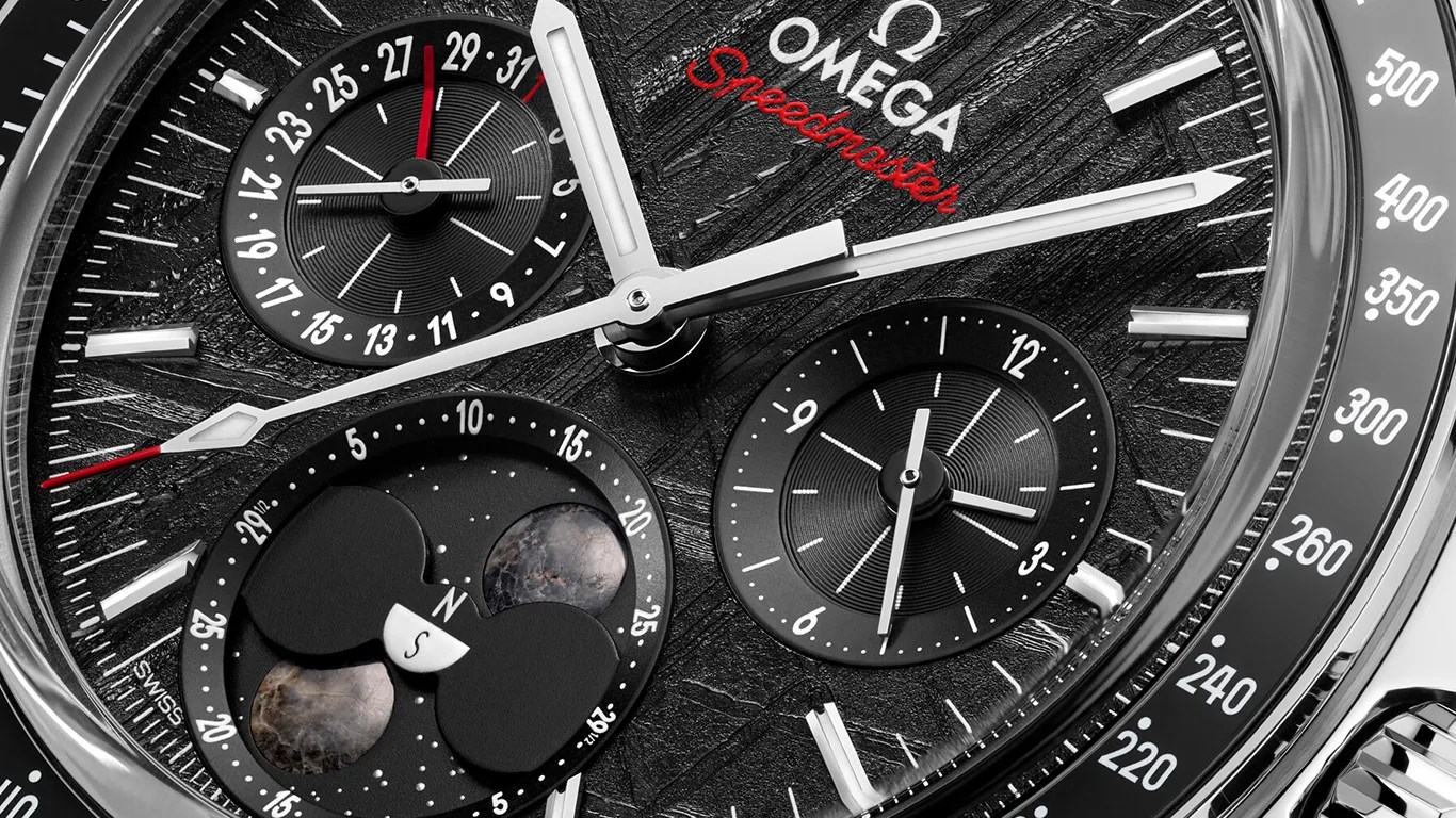 a closeup of an omega speedmaster moonphase watch dial