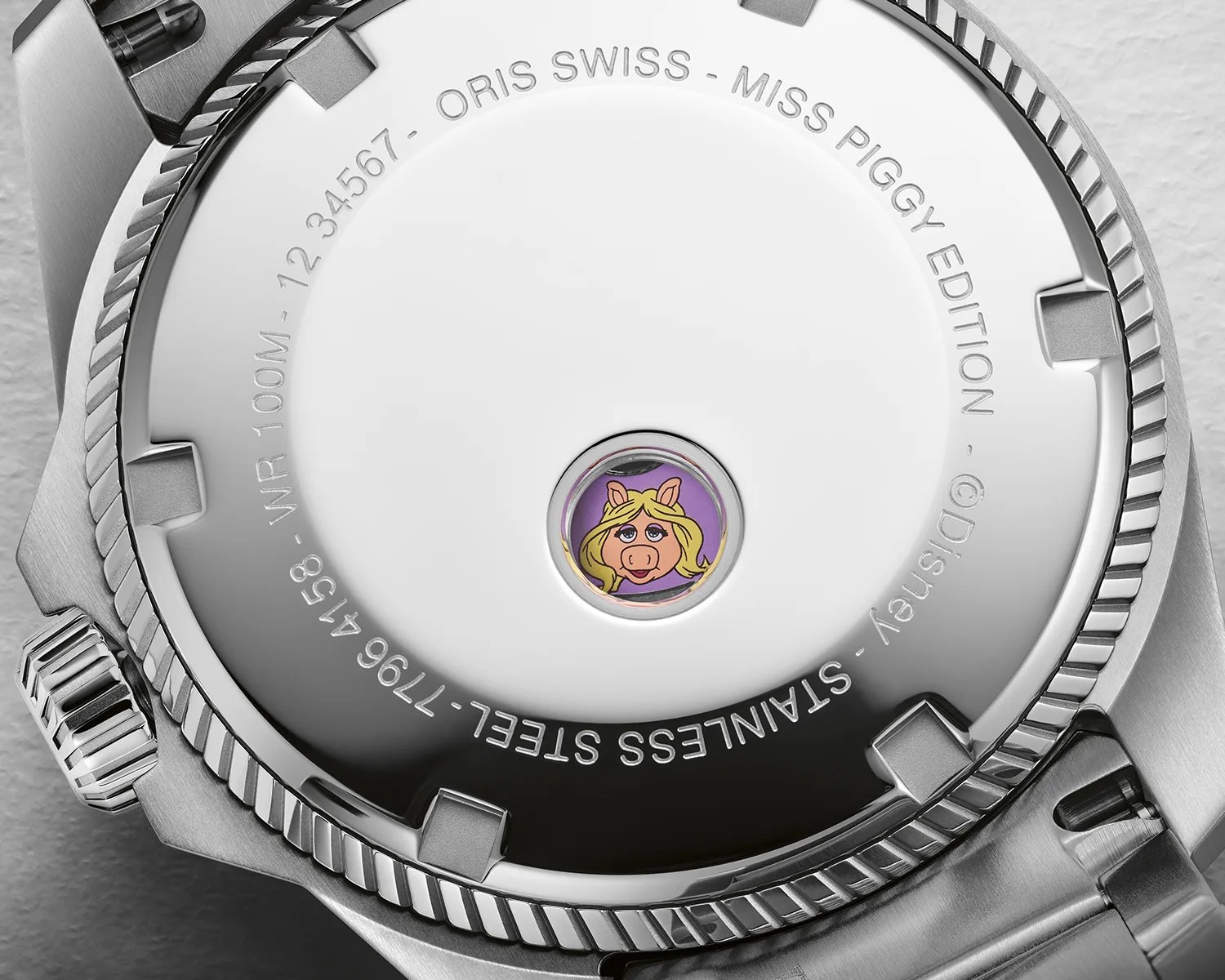 a caseback of an oris watch with a picture of miss piggy