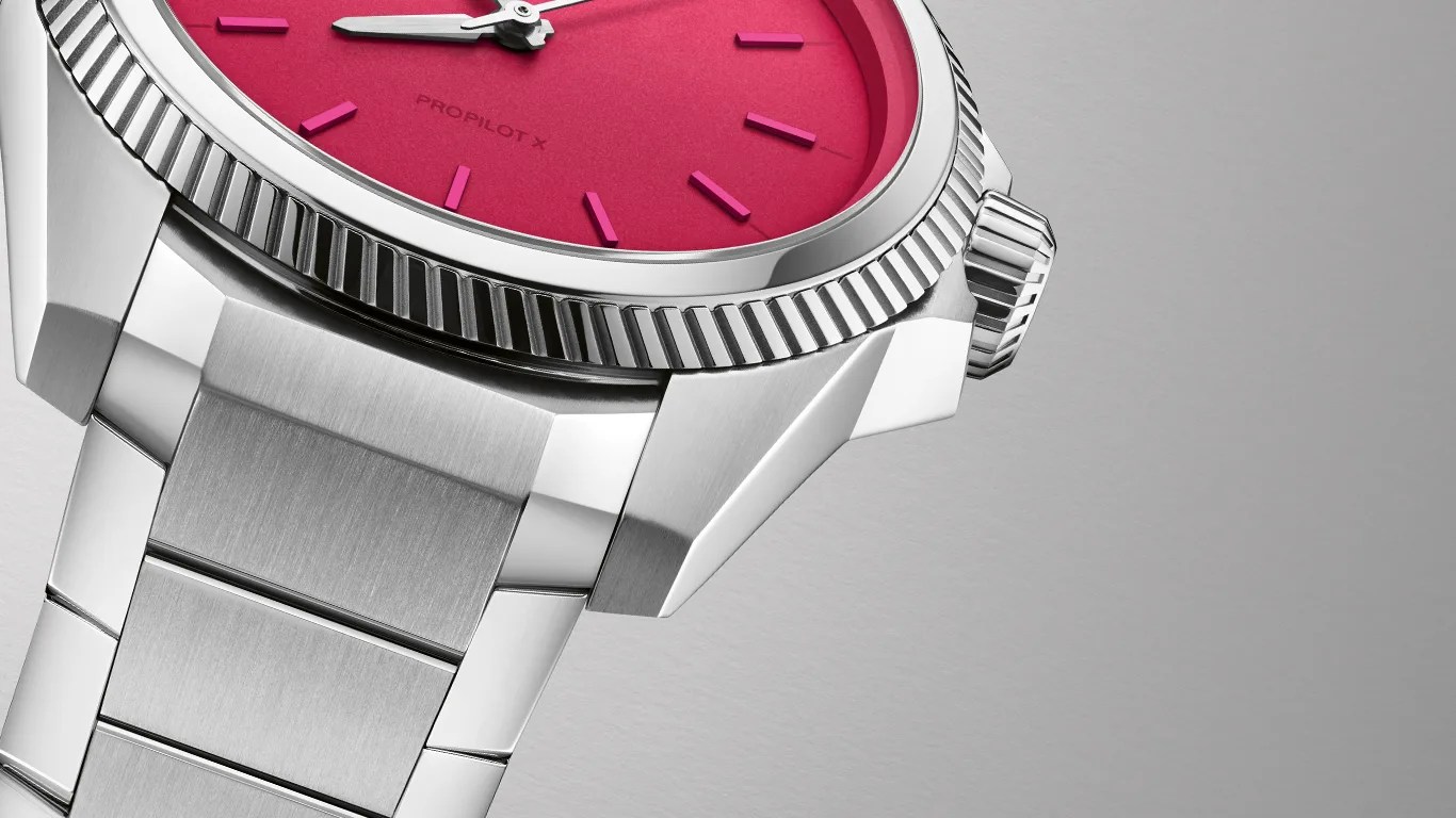 a closeup of a pink oris watch