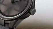 a closeup of a ulysse nardin watch against a foggy background