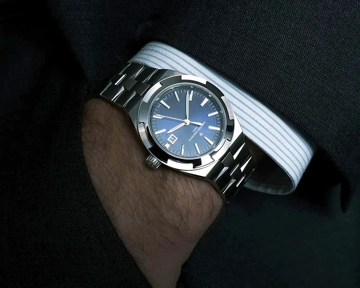 a man in a suit wears a vacheron constantin watch on his wrist