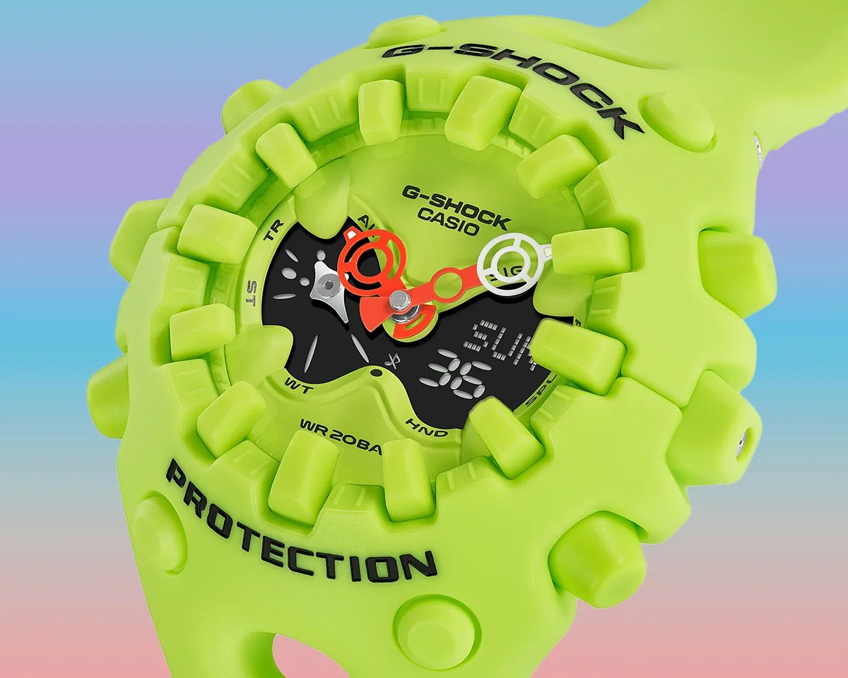 Closeup of Casio G-Shock GA-V01 watch on pastel rainbow background