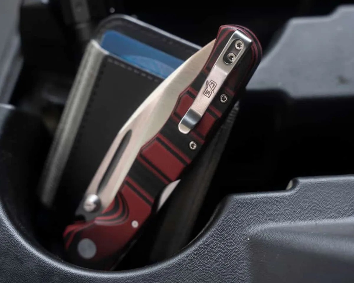 Cold Steel Frenzy II knife with wallet in car cupholder