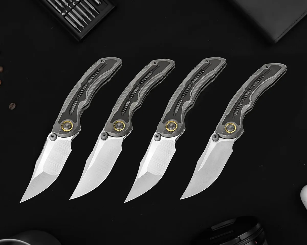 Kizer Silverwing knives on black background