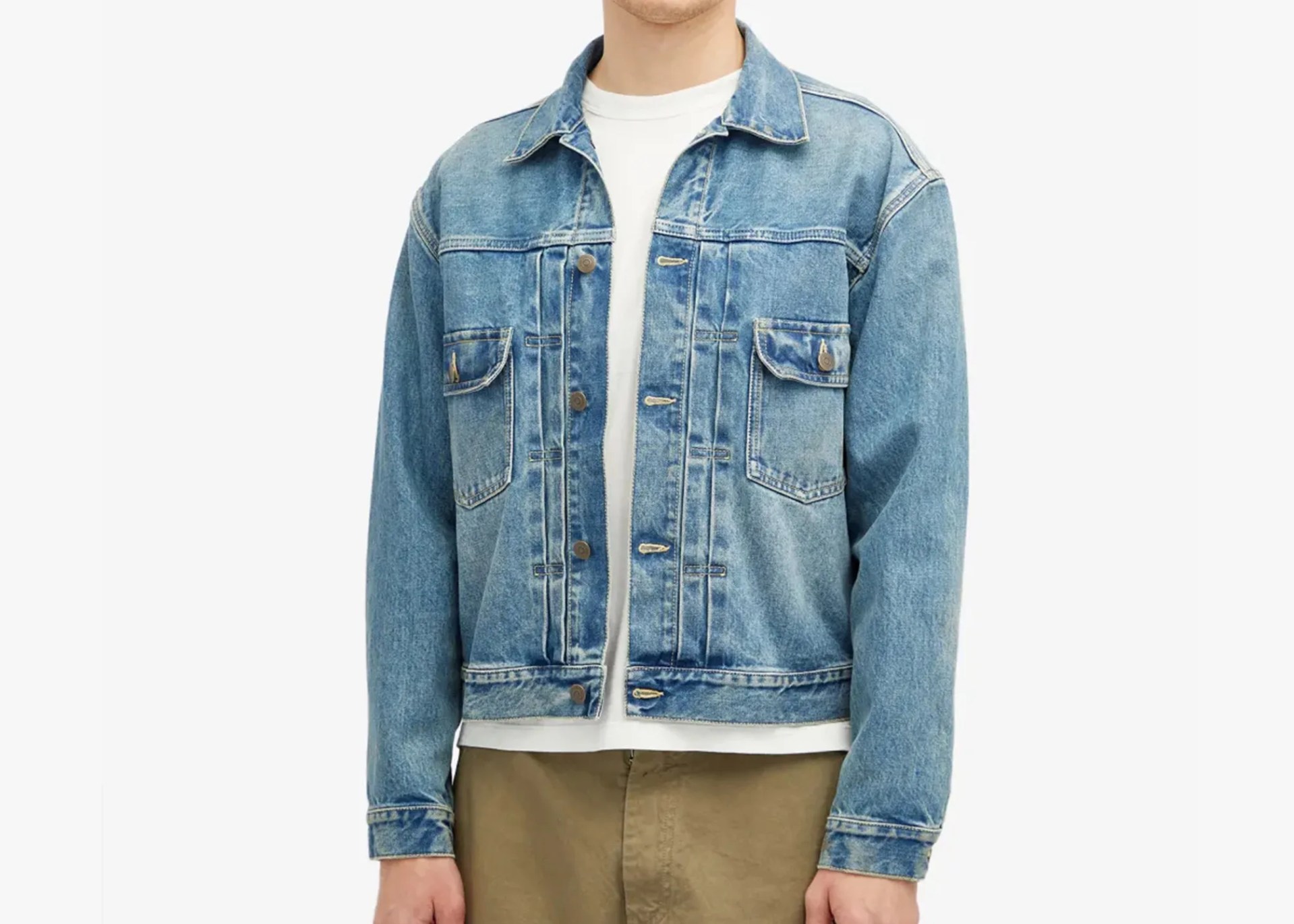 a man wearing a faded jean jacket