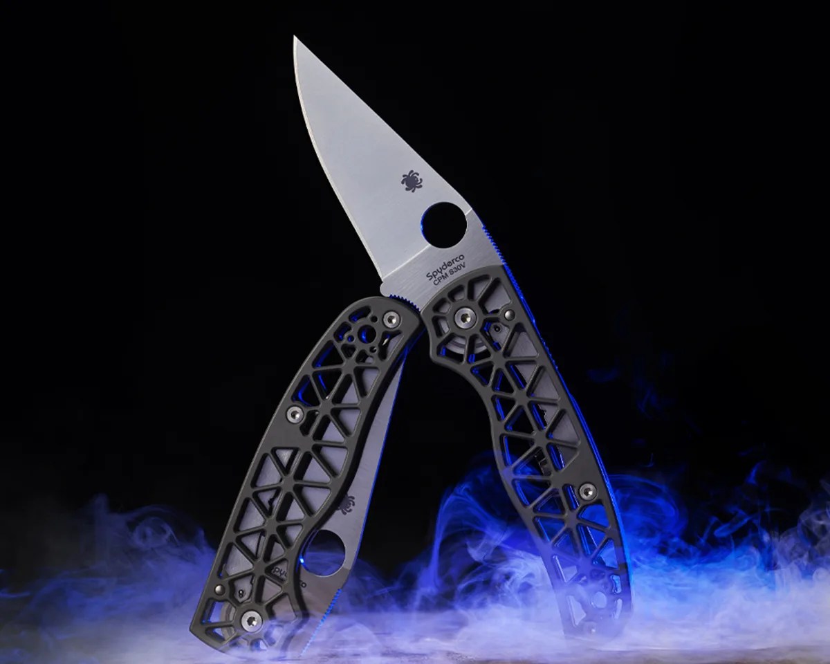 Spyderco Edgerati knives on black background surrounded by blue smoke
