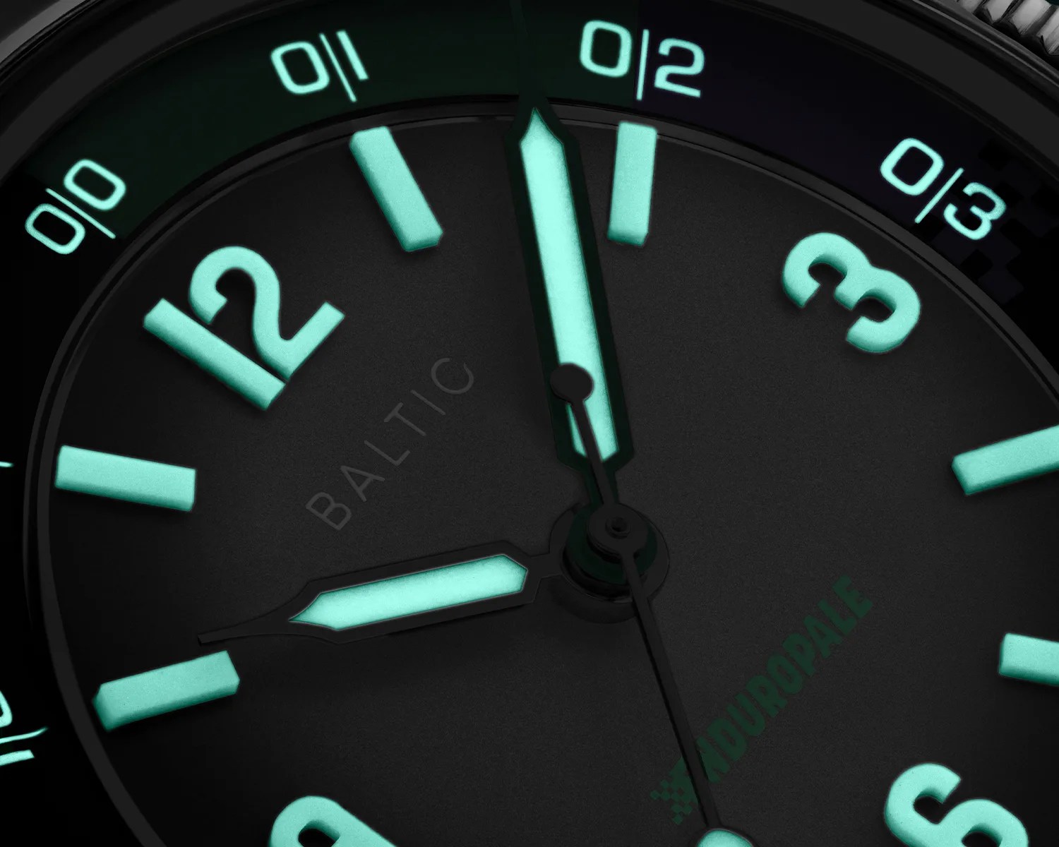 a closeup of a a baltic watch dial glowing in the dark