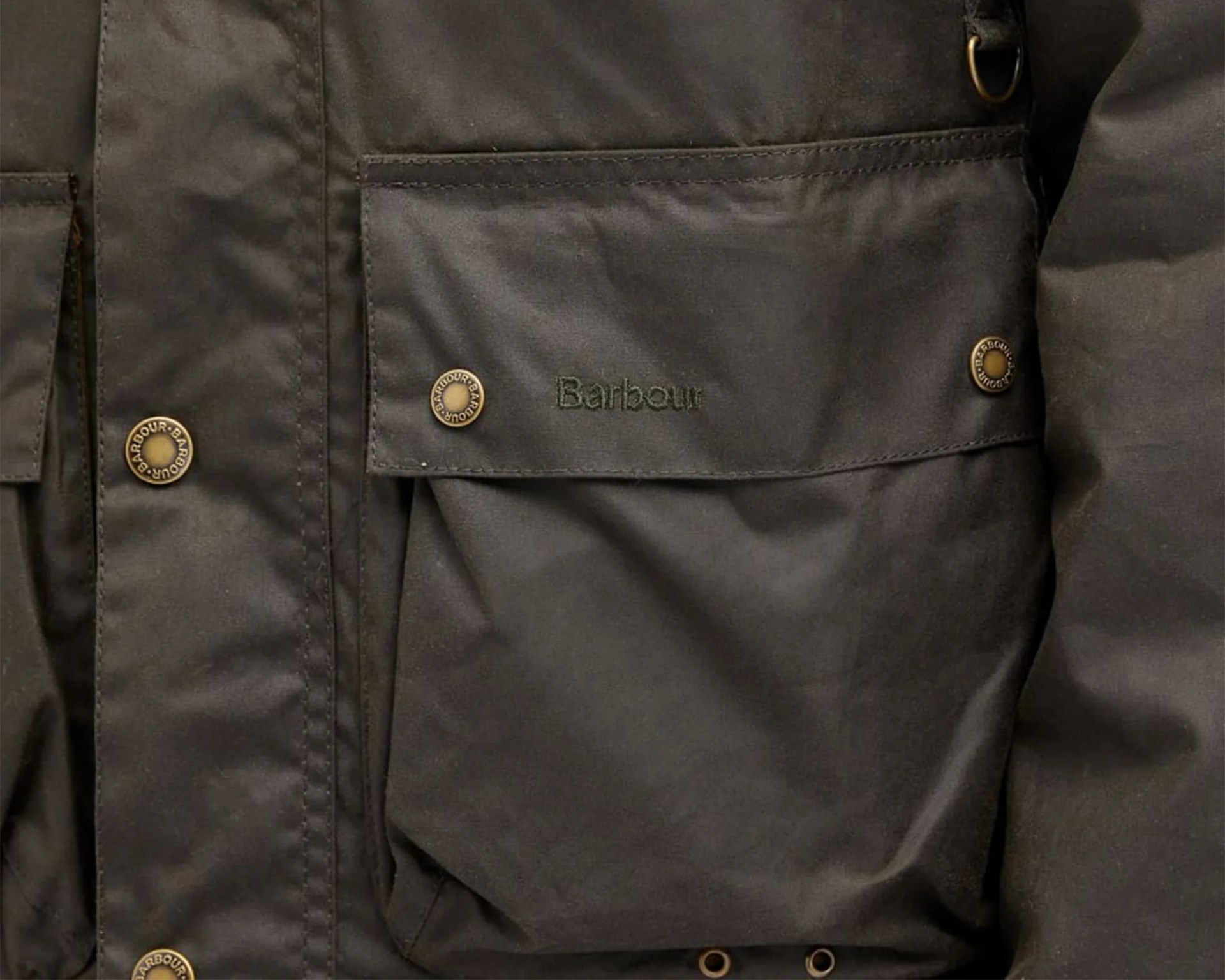 a snap flap pocket on a waxed cotton jacket
