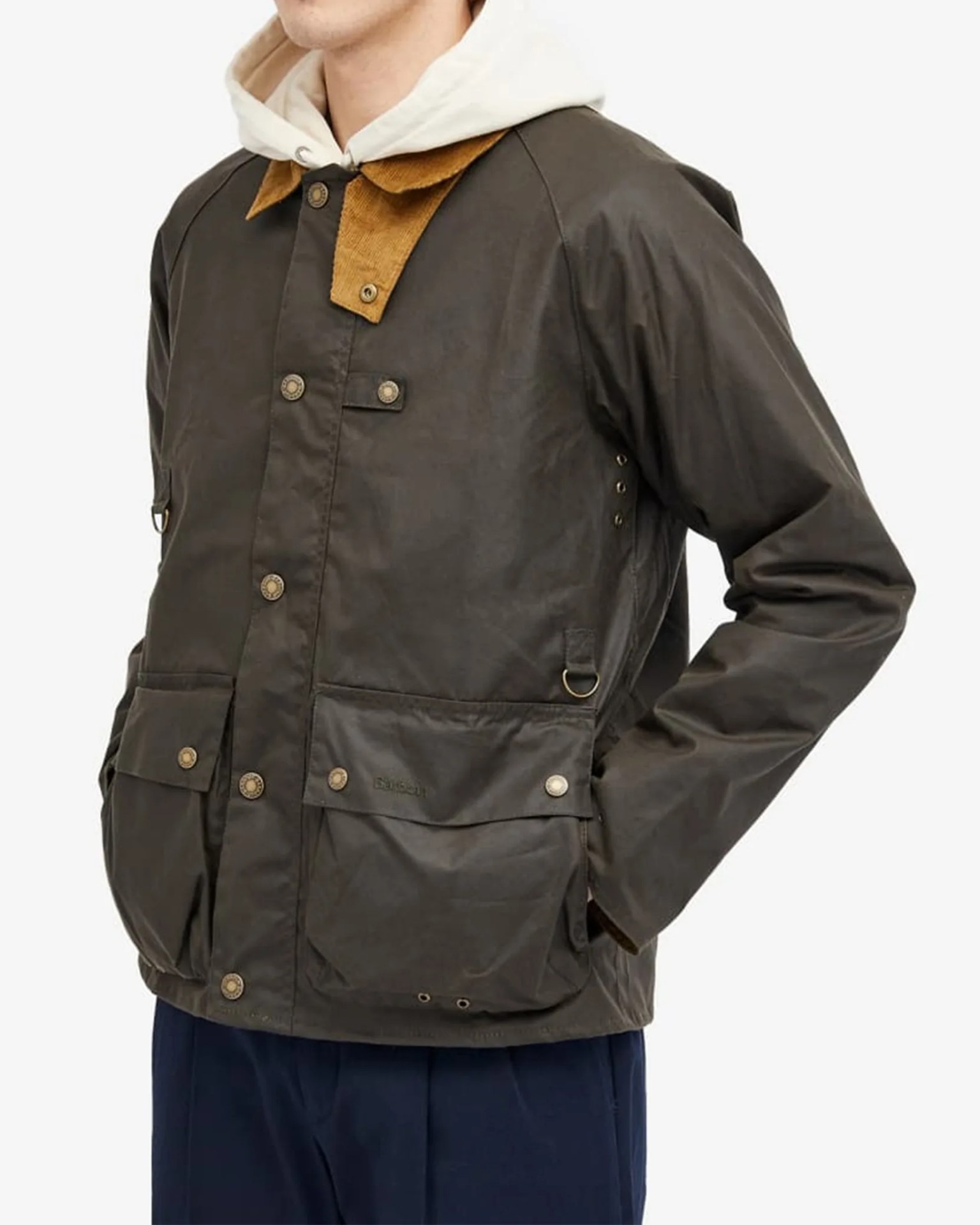 a man in a green jacket and hoodie