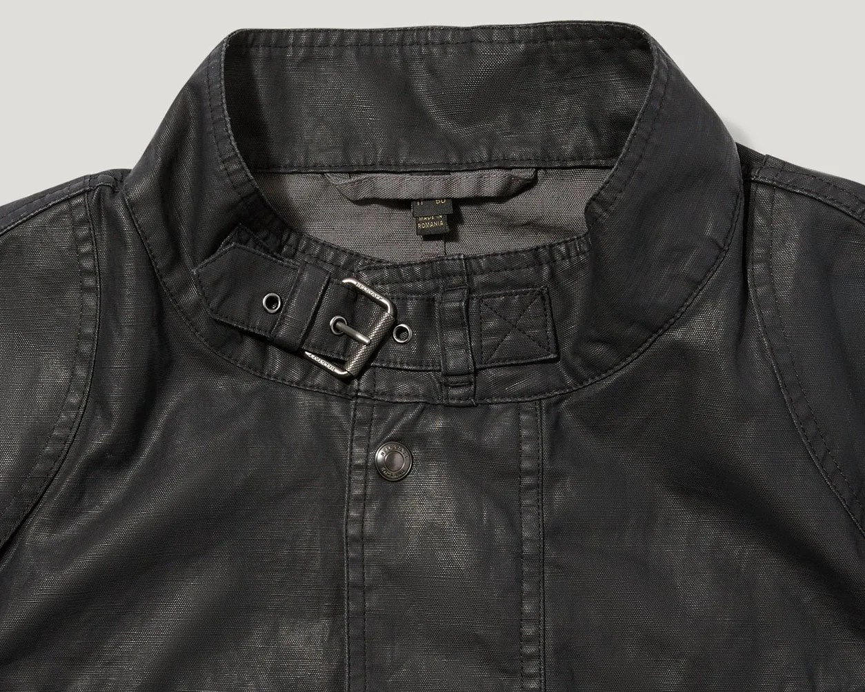 the collar and throat latch of a black moto jacket