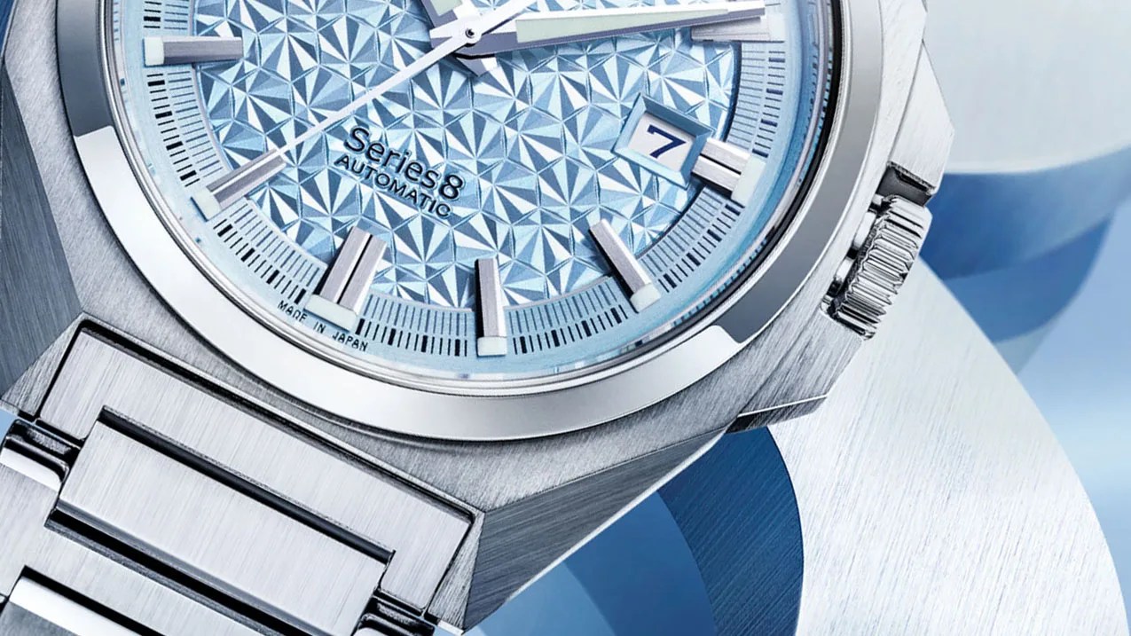 Close-up of a steel Citizen Series 8 watch with a textured light blue dial