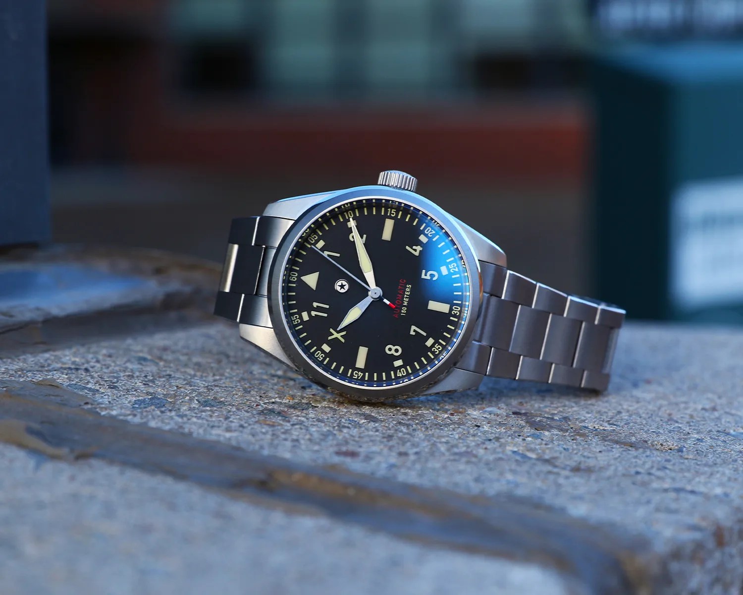 a jack mason pilots watch on a stone windowsill