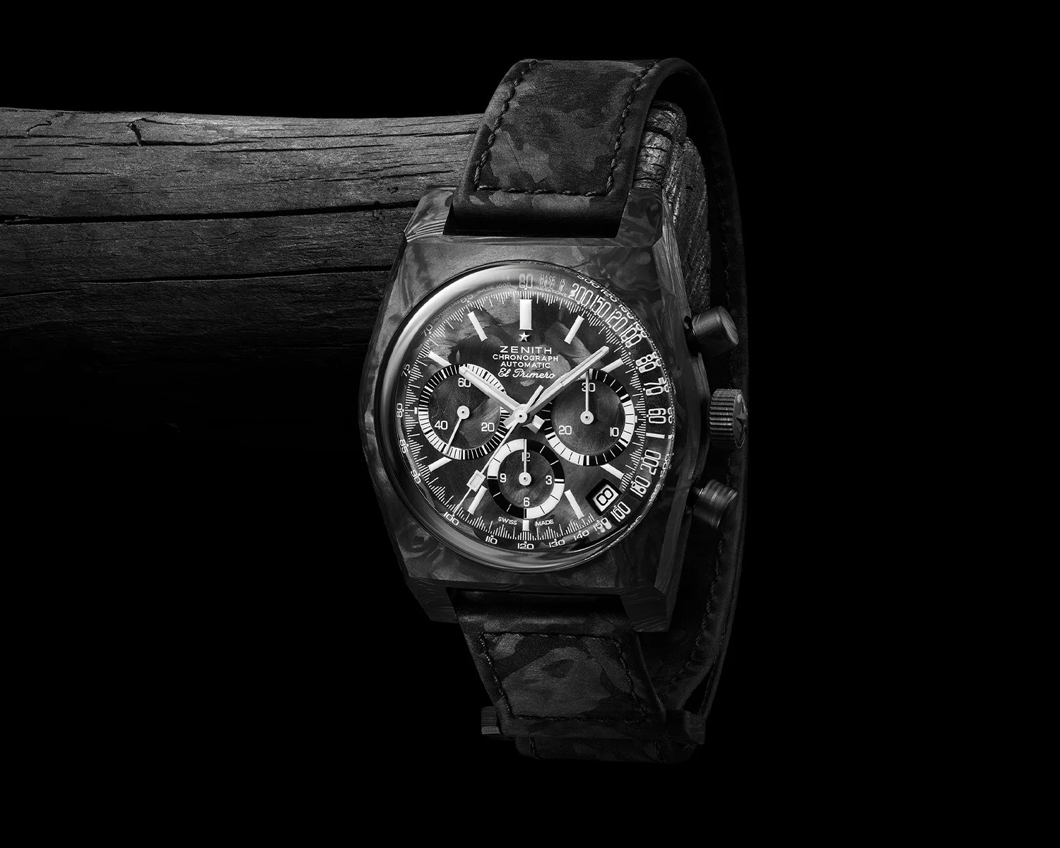 a zenith chronograph watch on a black log