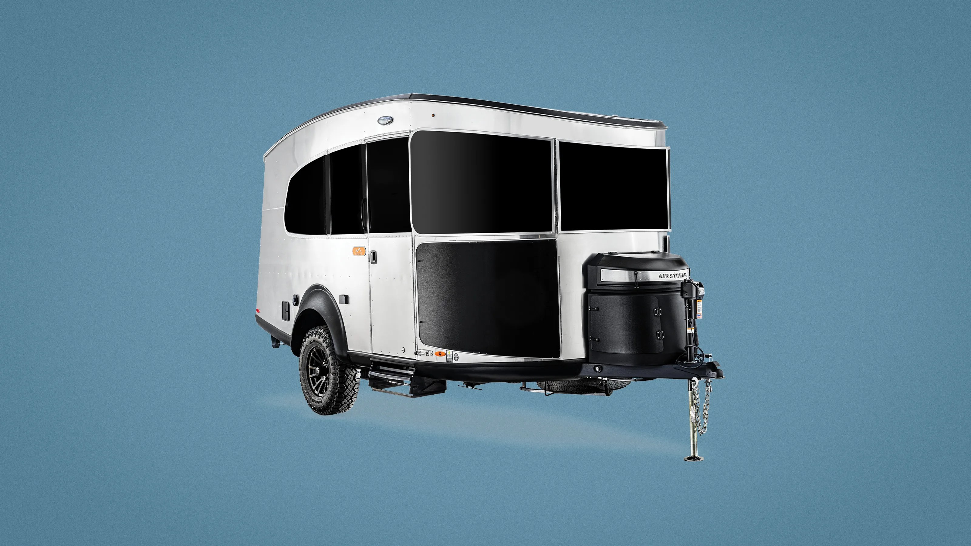 Airstream Basecamp Xe Adventure Trailer shown sitting against a light blue background