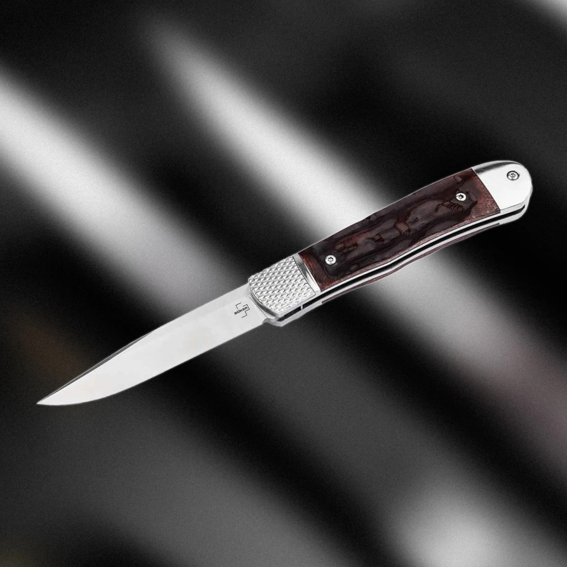 Böker Plus Hidden Release Trapper on blurry background