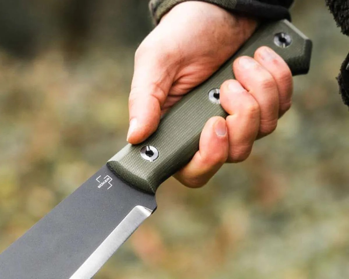 Closup of Böker Plus Northwood Bowie handle in hand outdoors