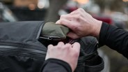 collapsed GoRuck Packable Bullet bag being pulled out of GR1 backpack