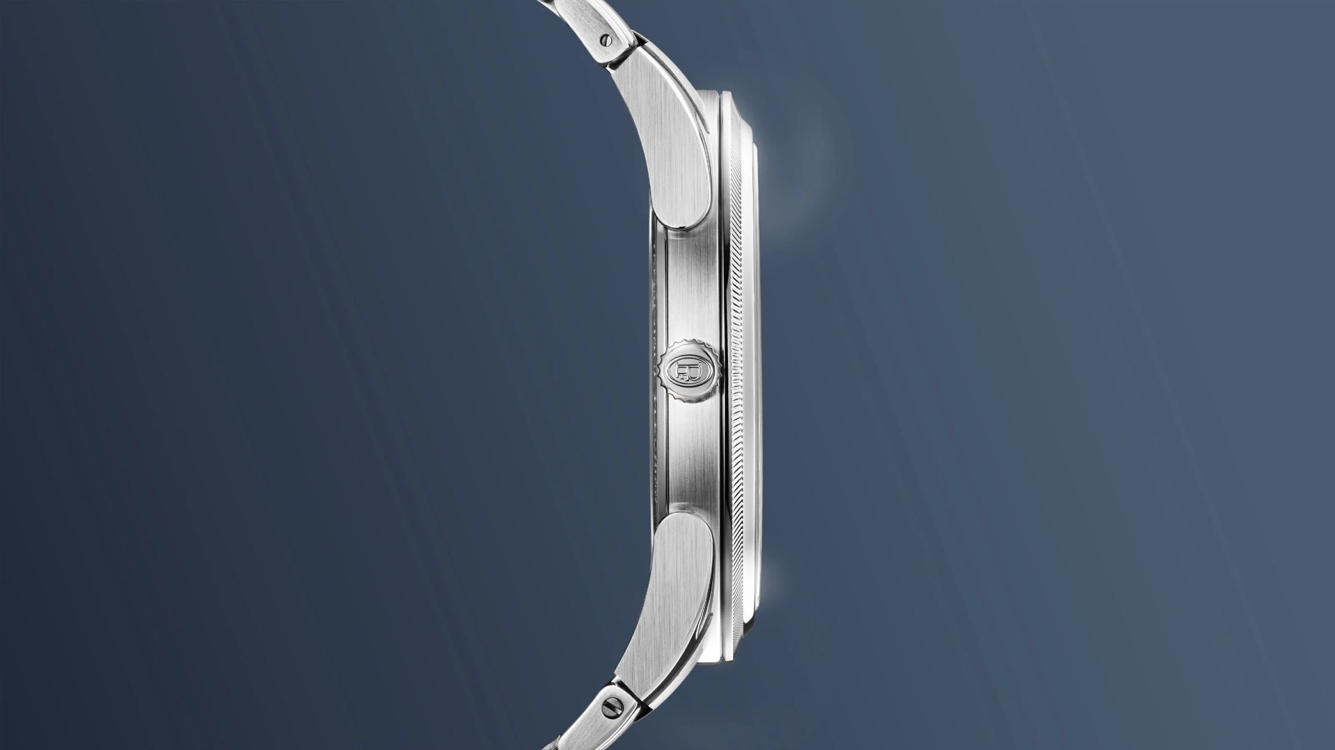 A profile view of the Parmigiani PF Micro-Rotor Platinum Stone Blue against a blue gradient background