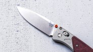 Benchmade Bugout Redstone knife blade on cement