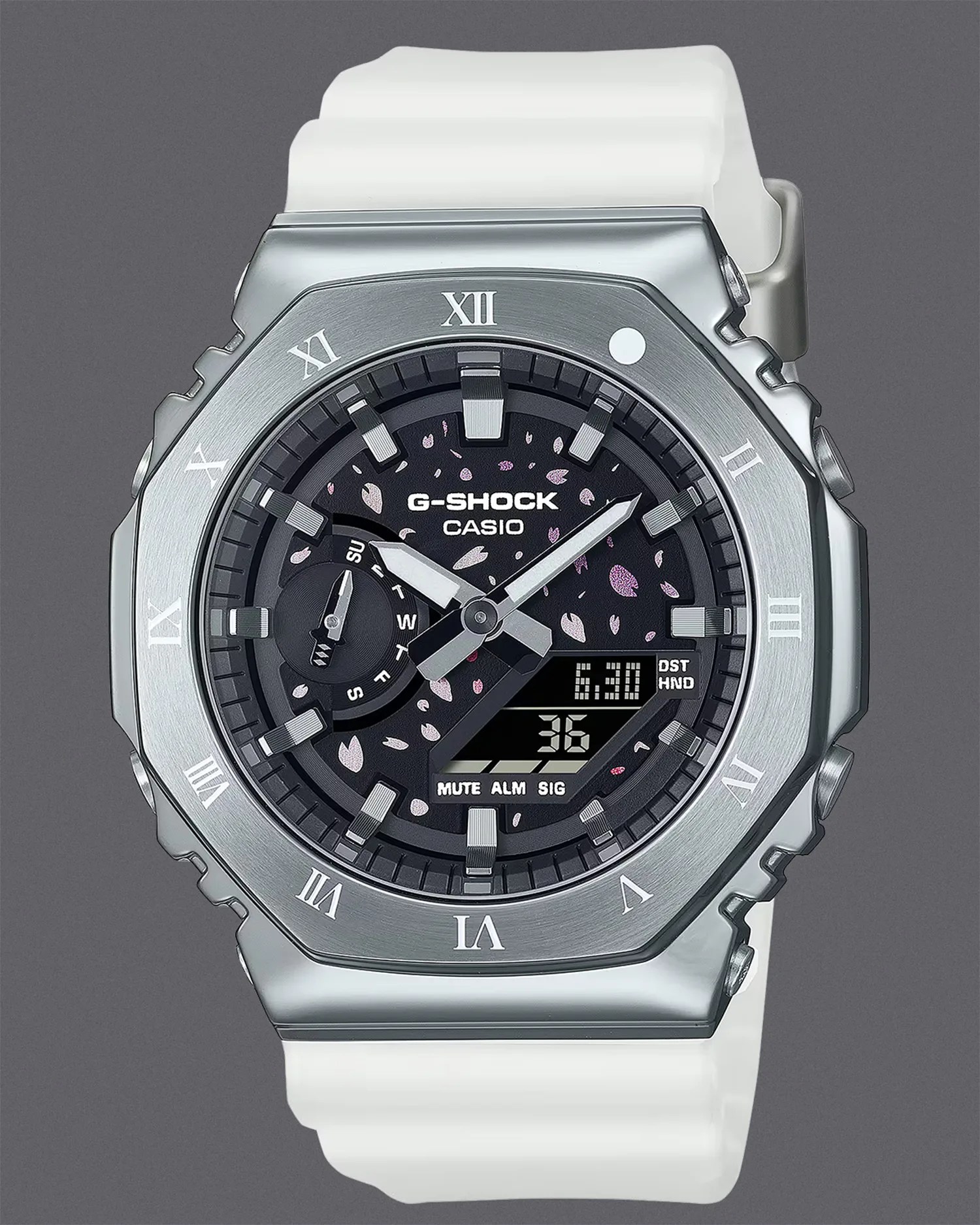 a Casio G-Shock watch with a dark purple dial, silver bezel and white strap
