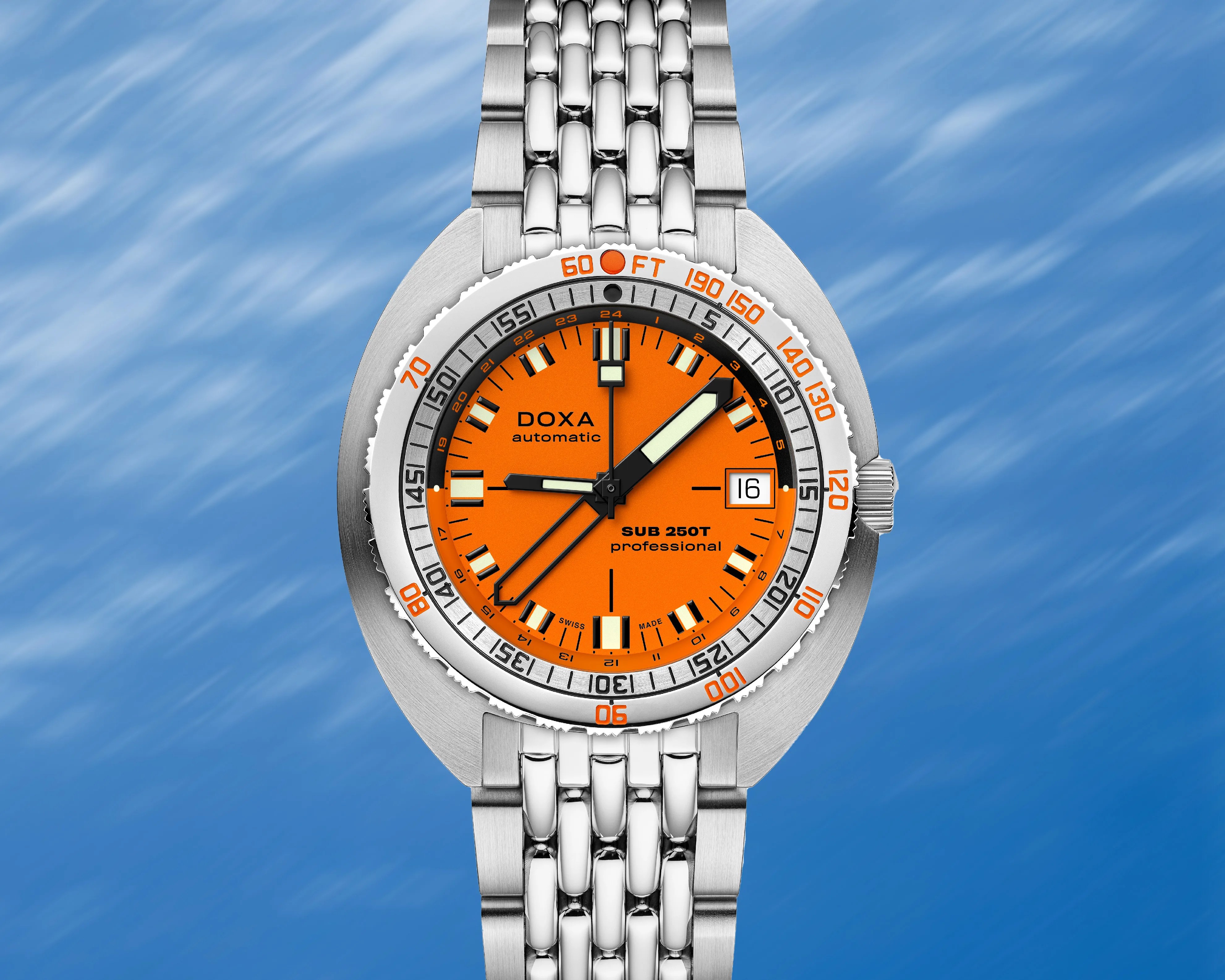an orange Doxa gmt dive watch