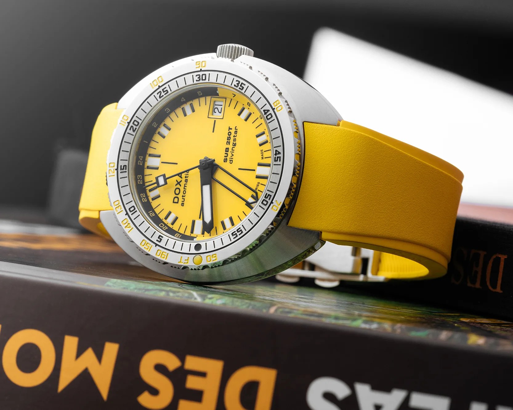a yellow Doxa GMT dive watch