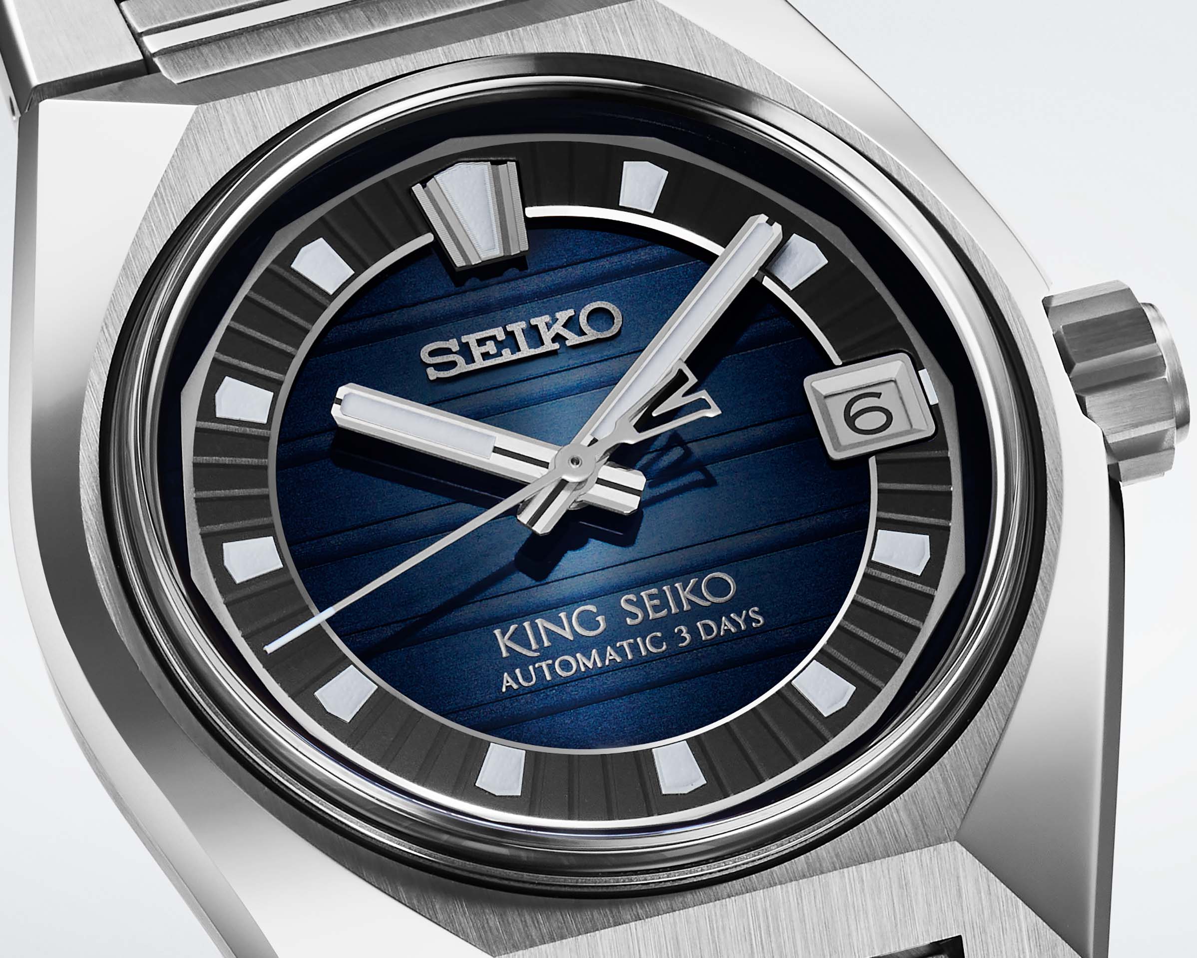 the blue and black dial of a Seiko watch