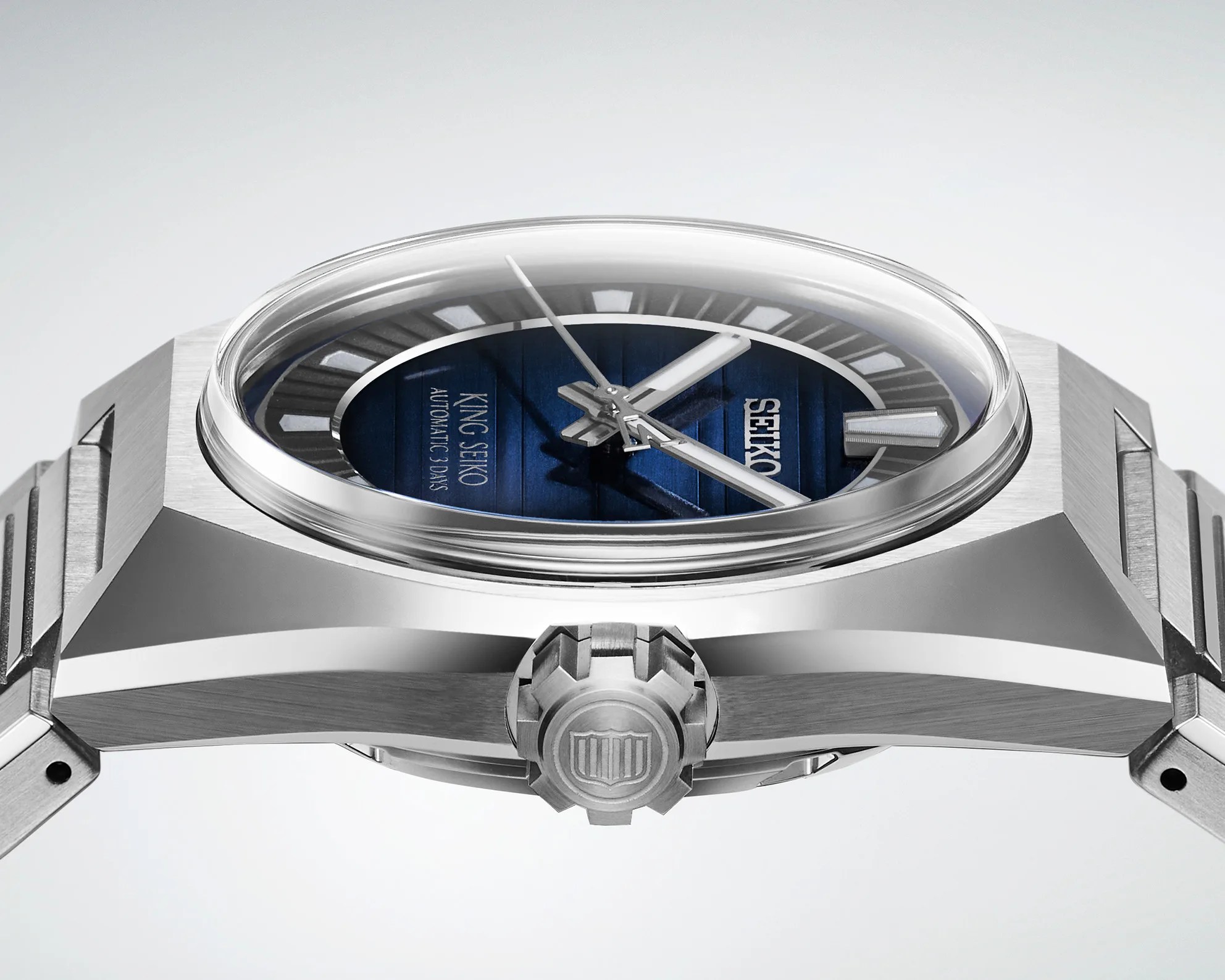 the side and crown of a steel King Seiko watch