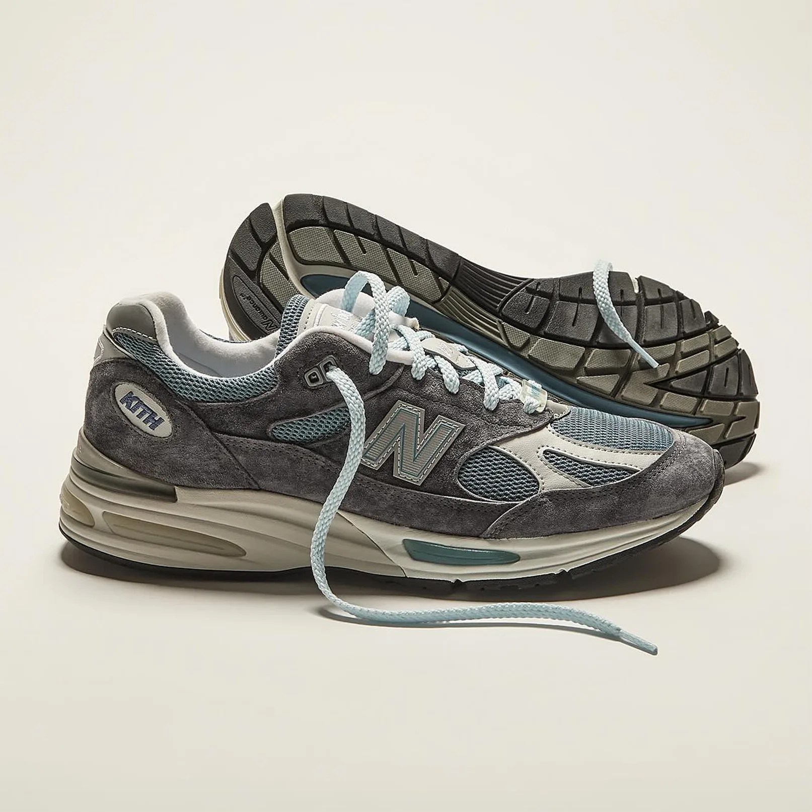 a pair of gray and blue running shoes