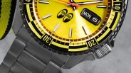 the dial and bezel of yellow Seiko 5 Sports watch