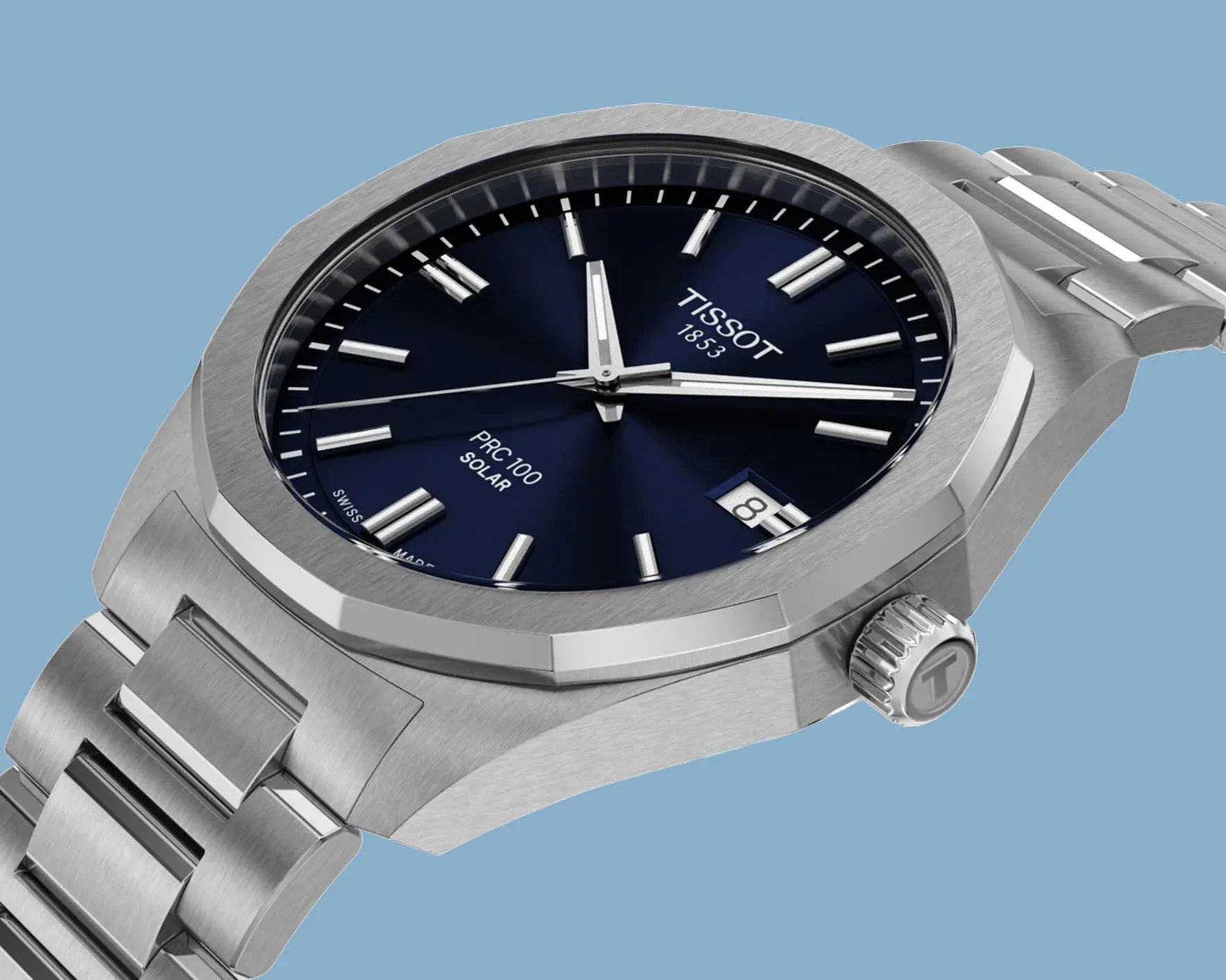a steel Tissot watch with a blue dial