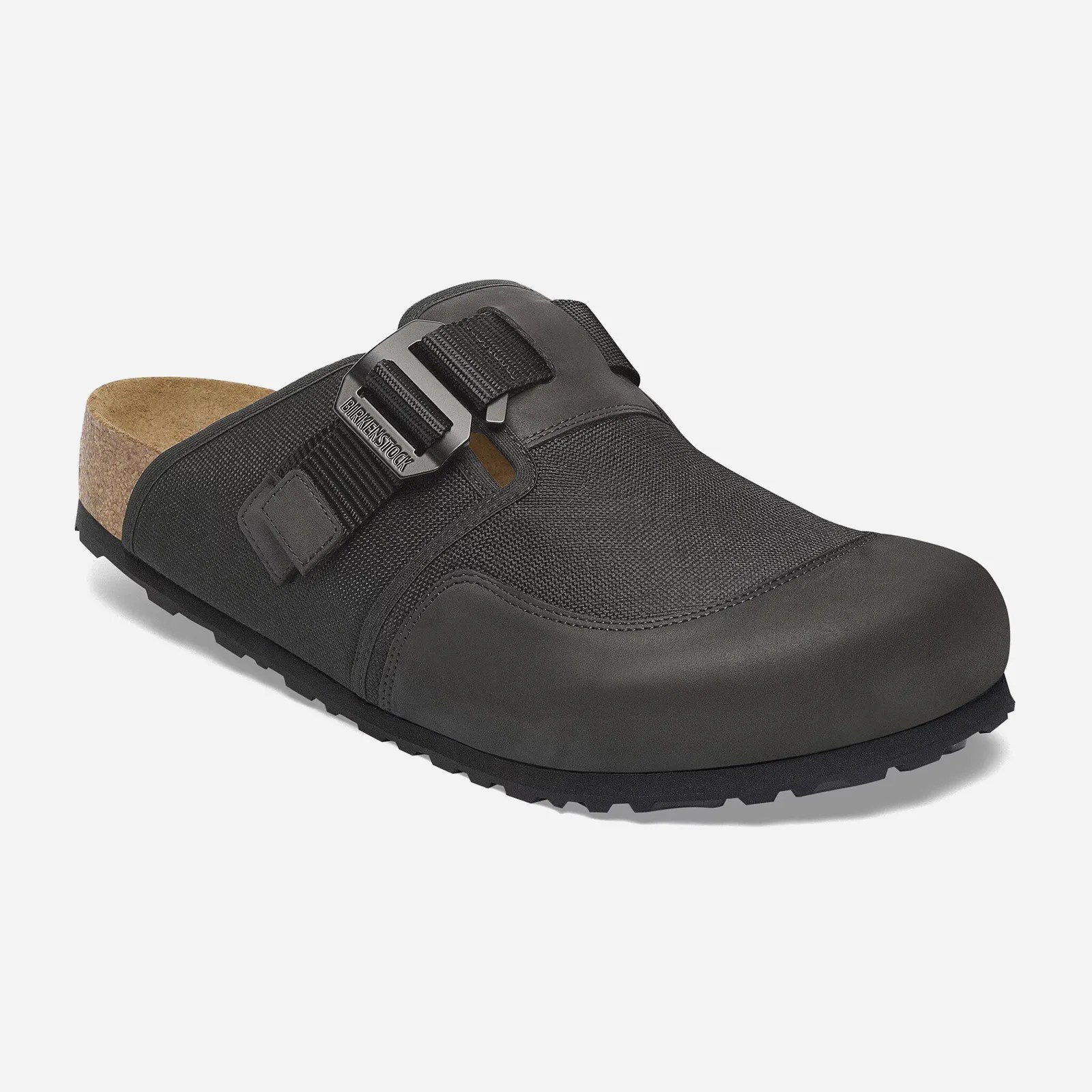 A single left Birkenstock Boston Nova sandal in black shown at an angle with the toe pointing to the right hand corner of the image against a light grey background. 