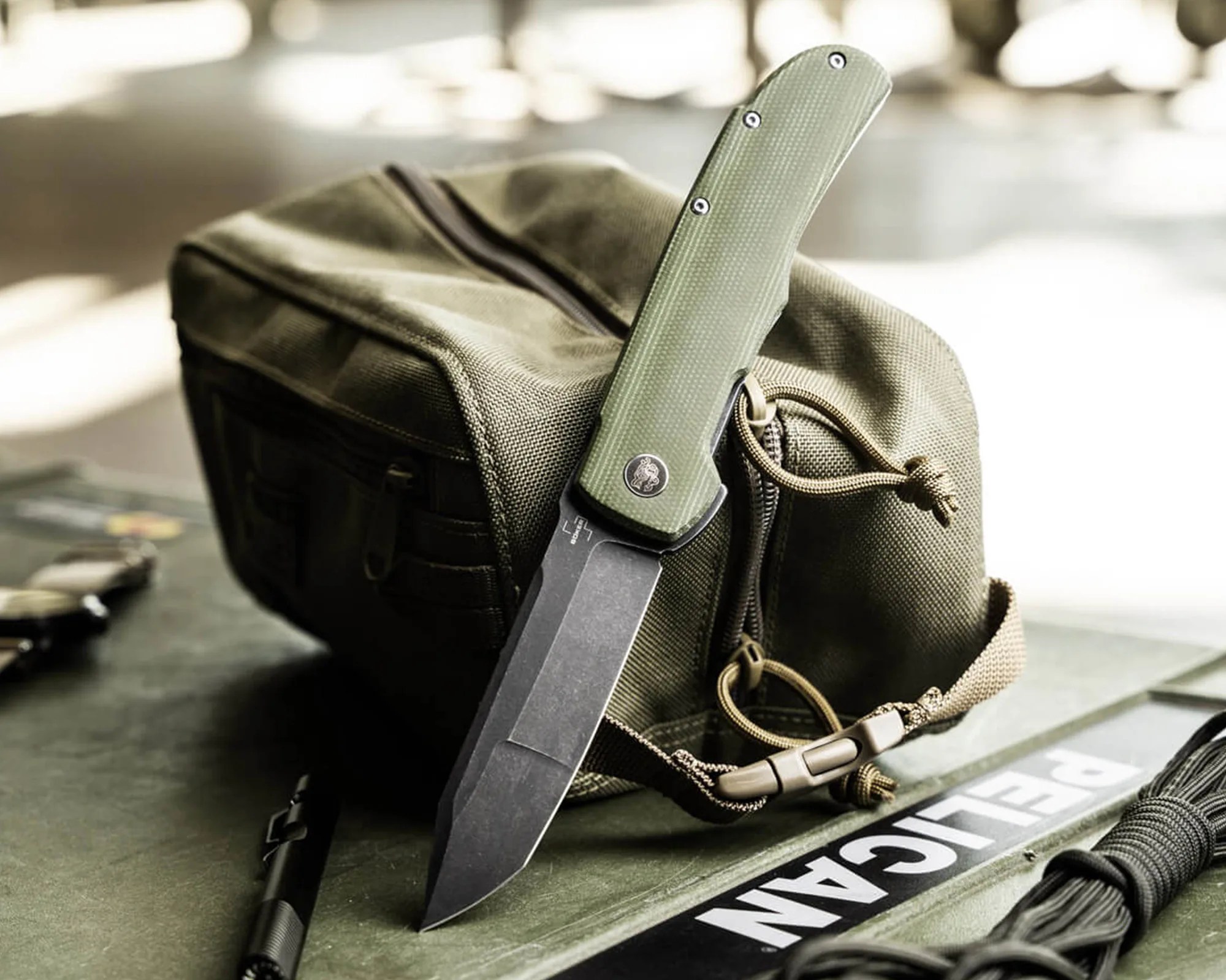 Böker Plus Tac-Master knife in front of dopp kit