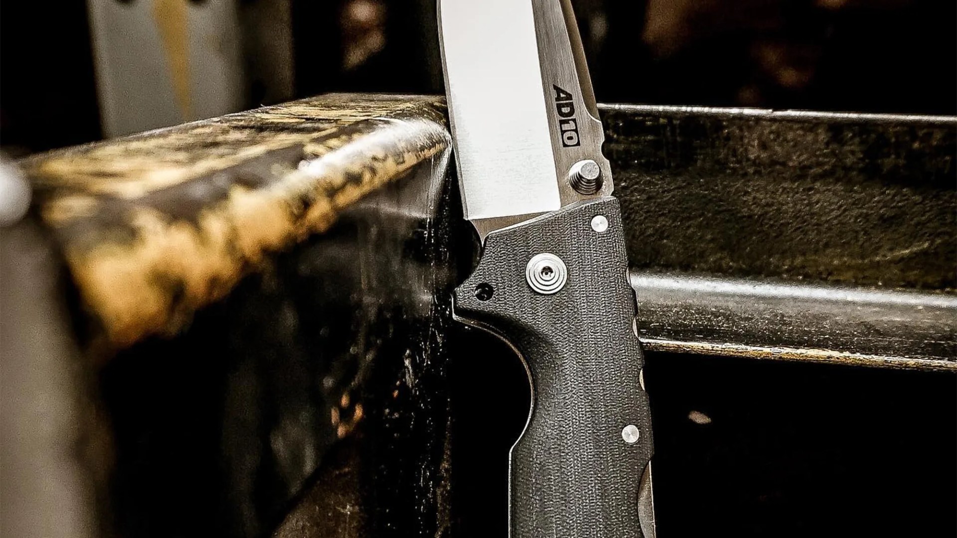 Cold Steel AD-10 knife in industrial setting closeup