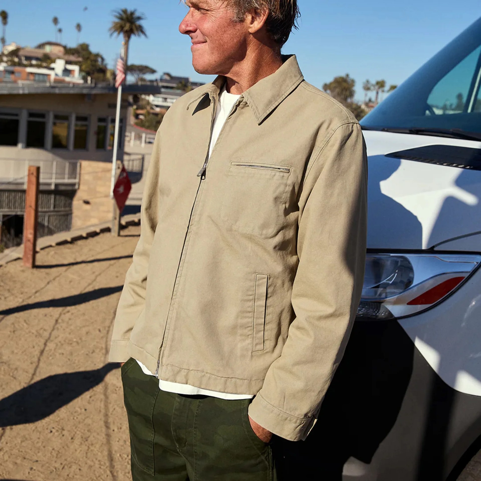 Outerknown The Craftsman Jacket worn by man at the beach