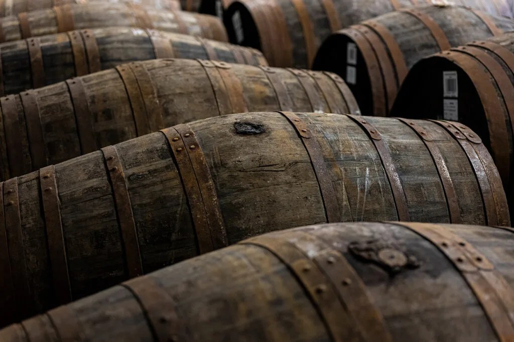 Barrels of The GlenAllachie whisky aging in warehouse