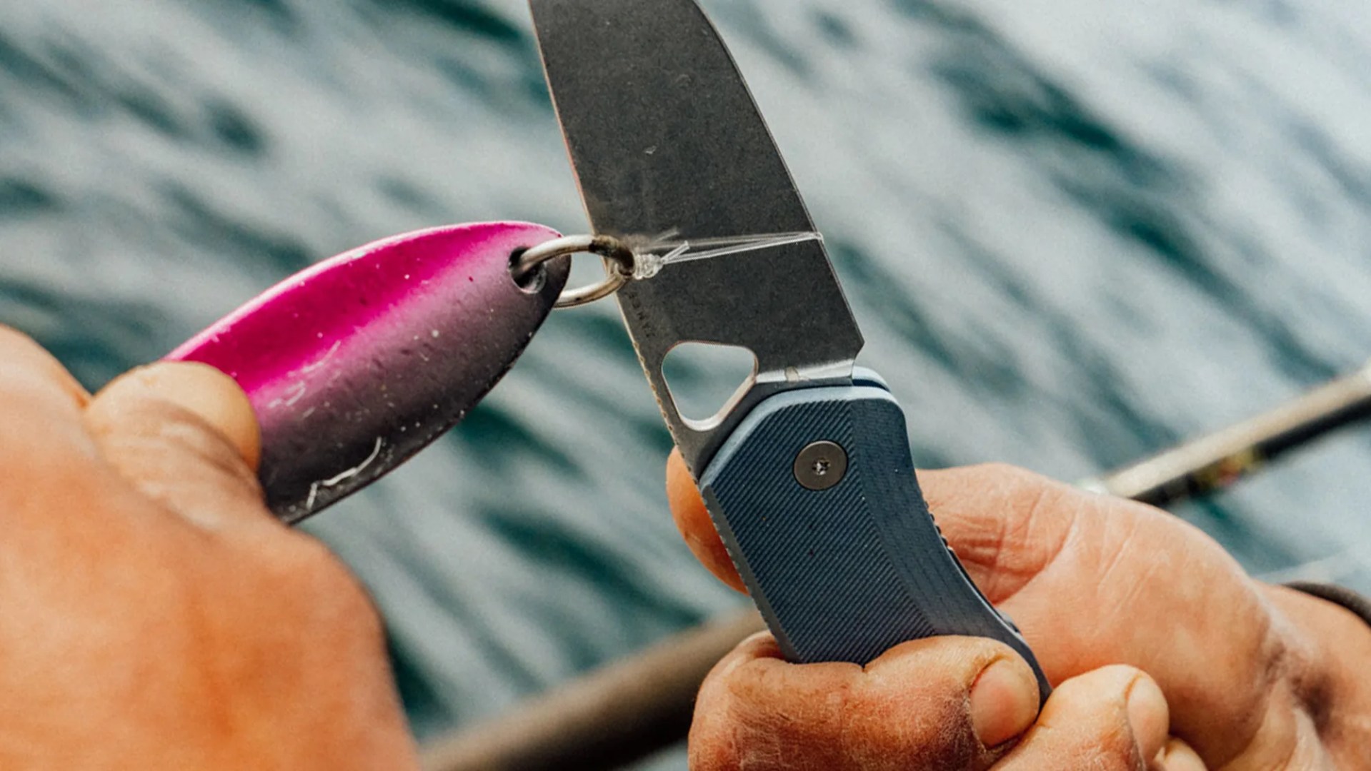 The James Brand Uncharted Collection Folsom Pro knife cutting fishing line on boat closeup