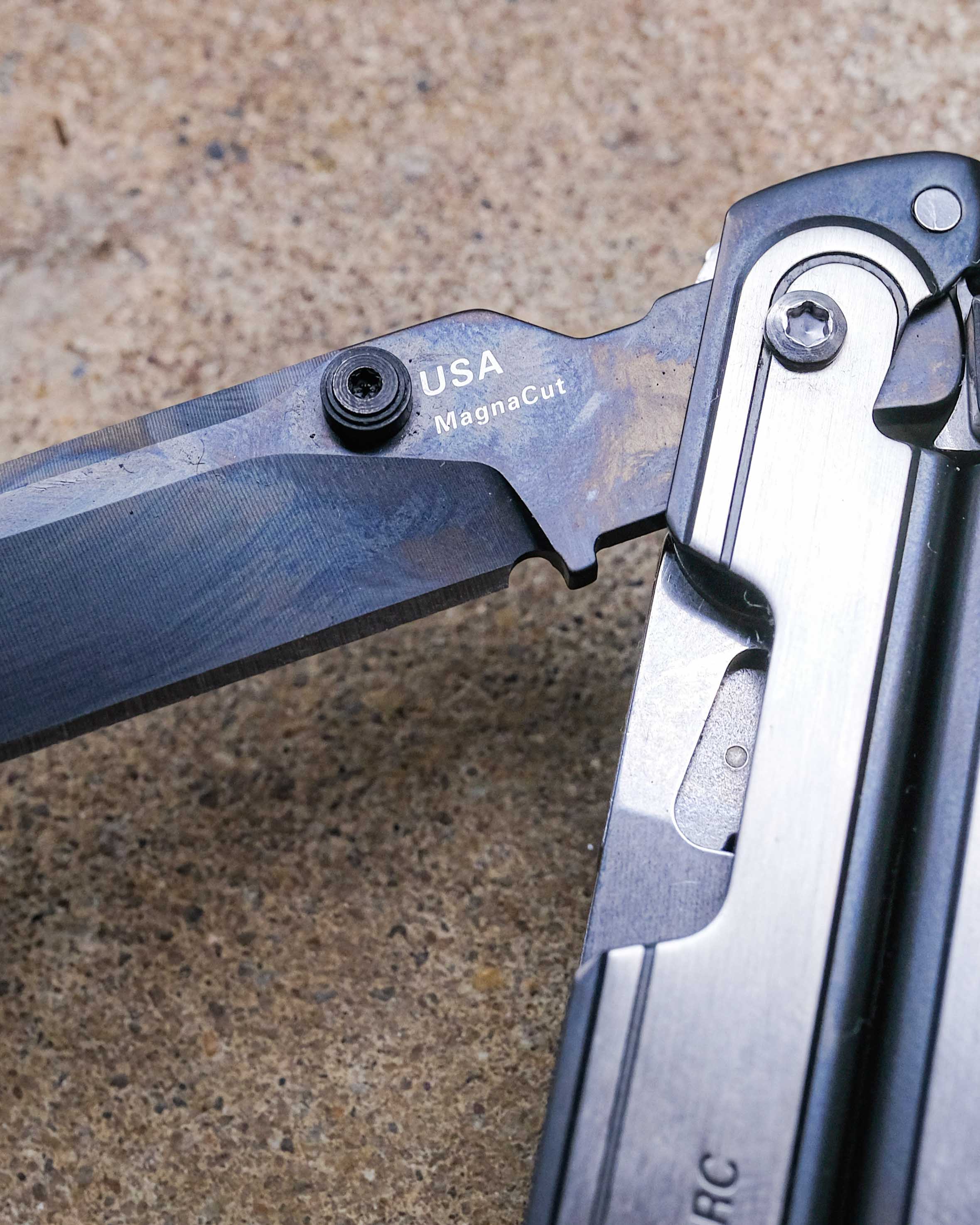 Leatherman multi-tool on concrete backdrop