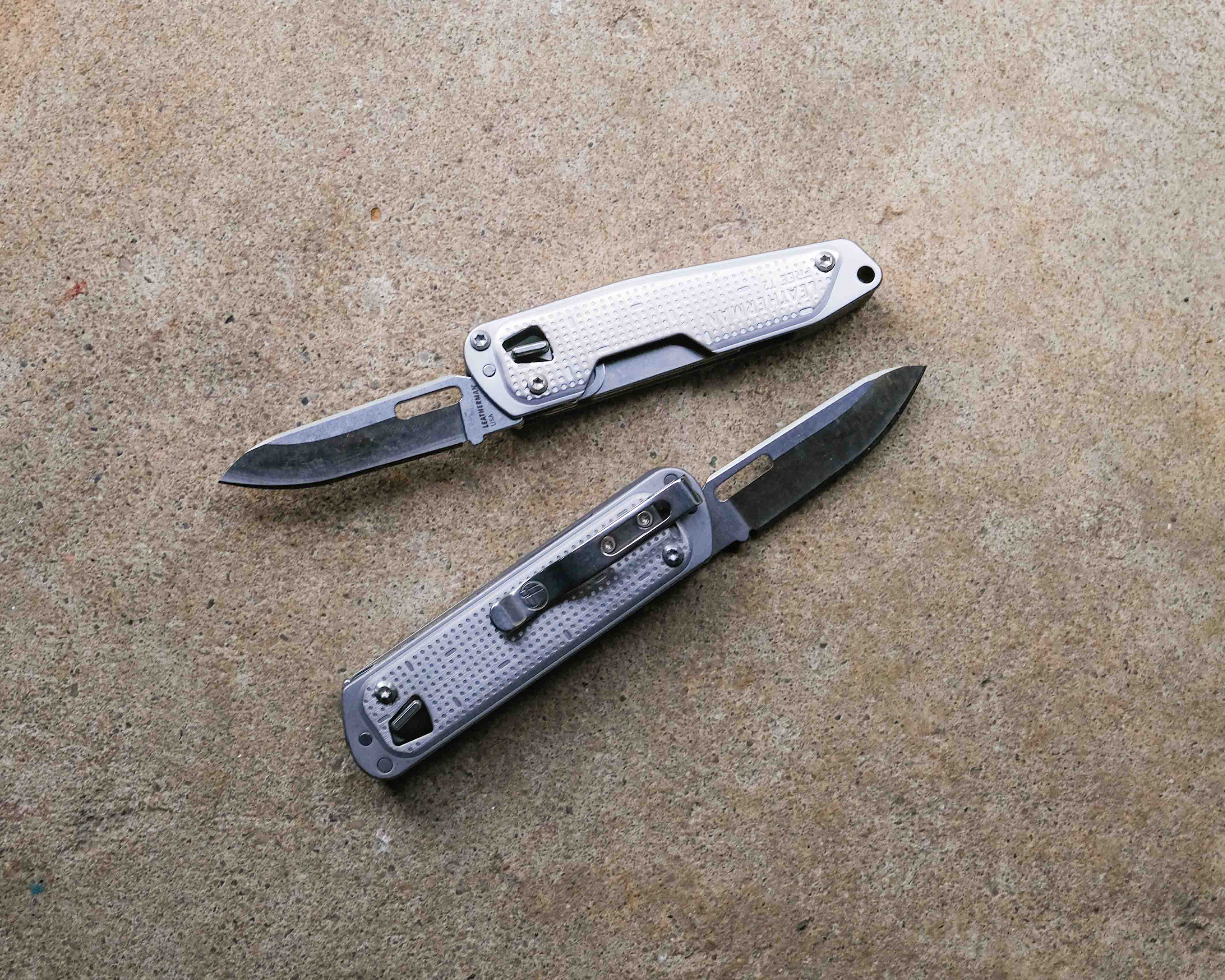 Leatherman multi-tool on concrete backdrop