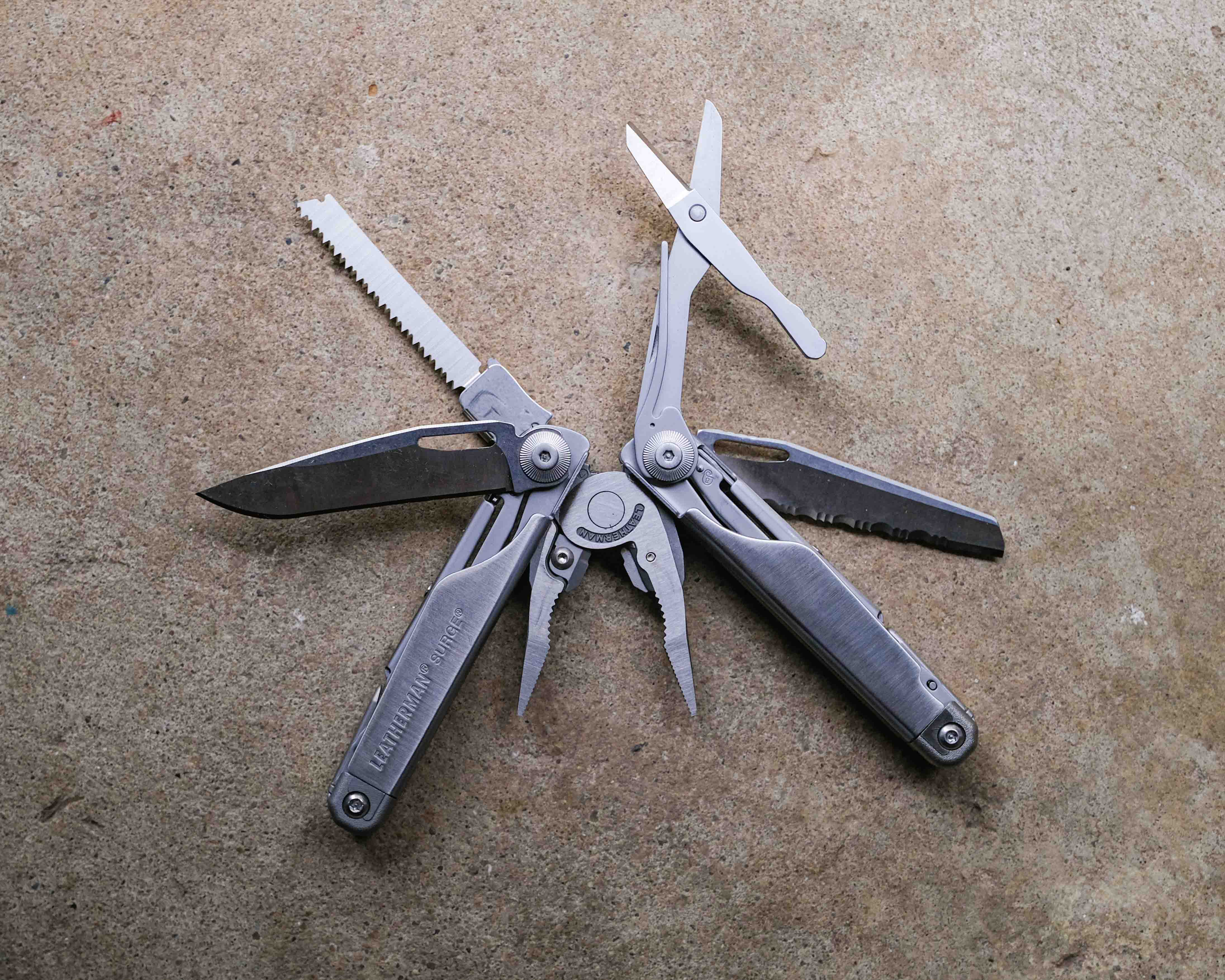Leatherman multi-tool on concrete backdrop