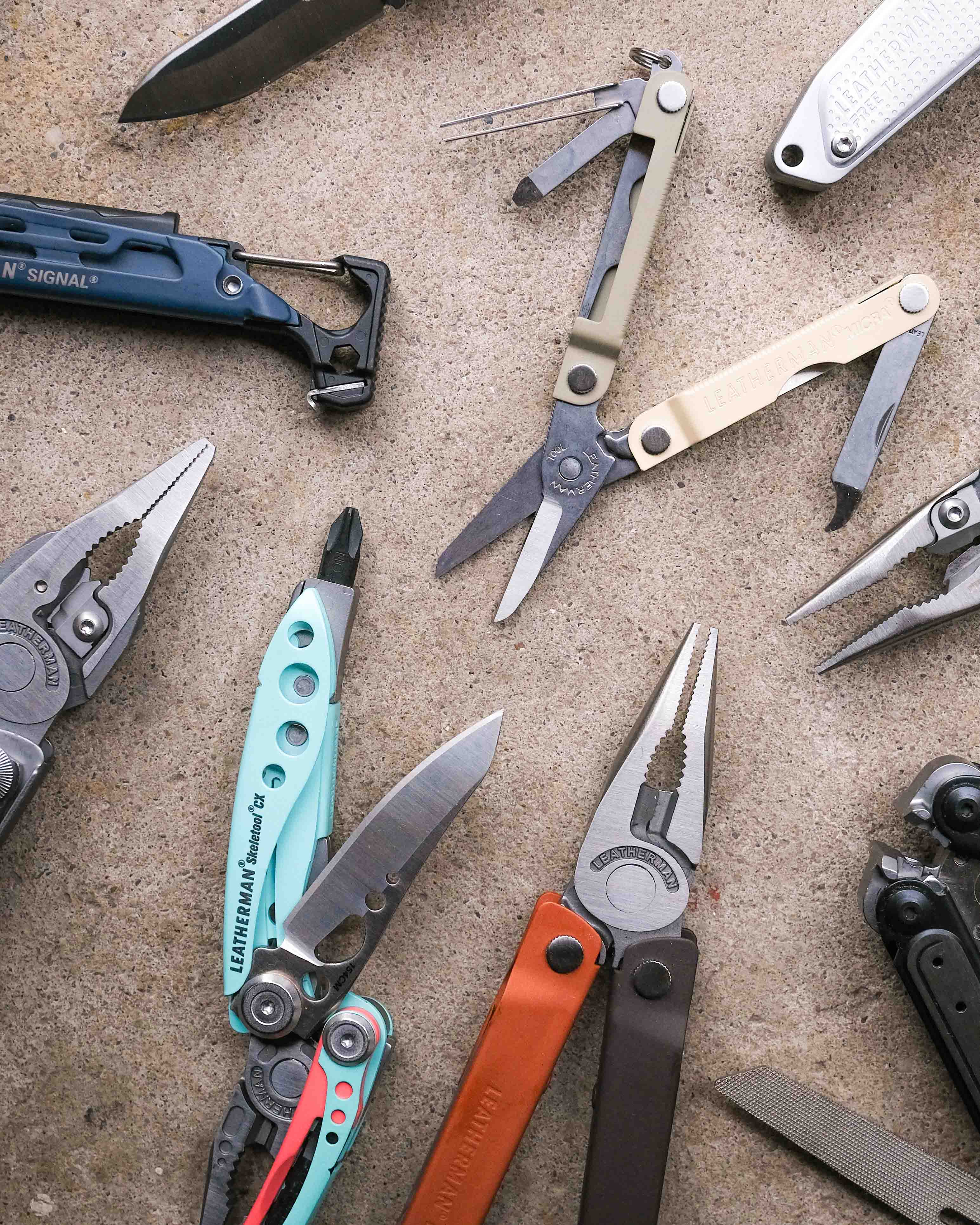 Leatherman multi-tools on concrete backdrop