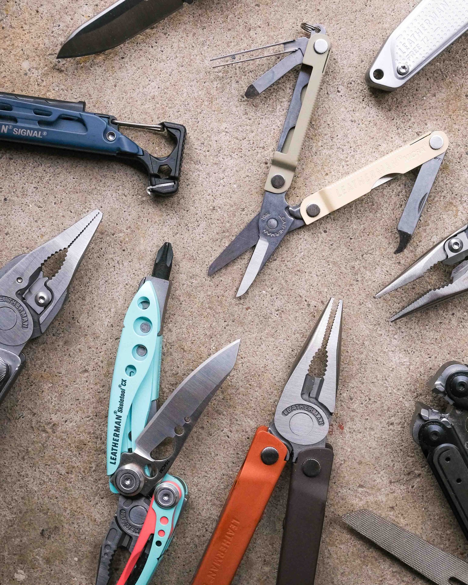 Leatherman multi-tools on concrete backdrop