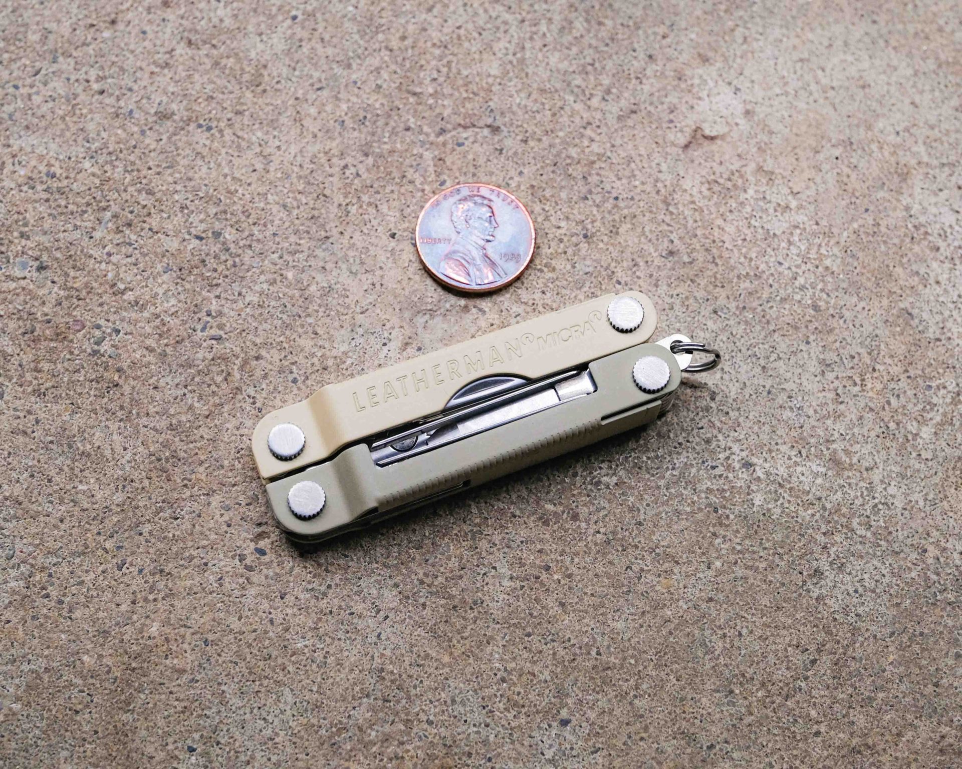 Leatherman multi-tool on concrete backdrop