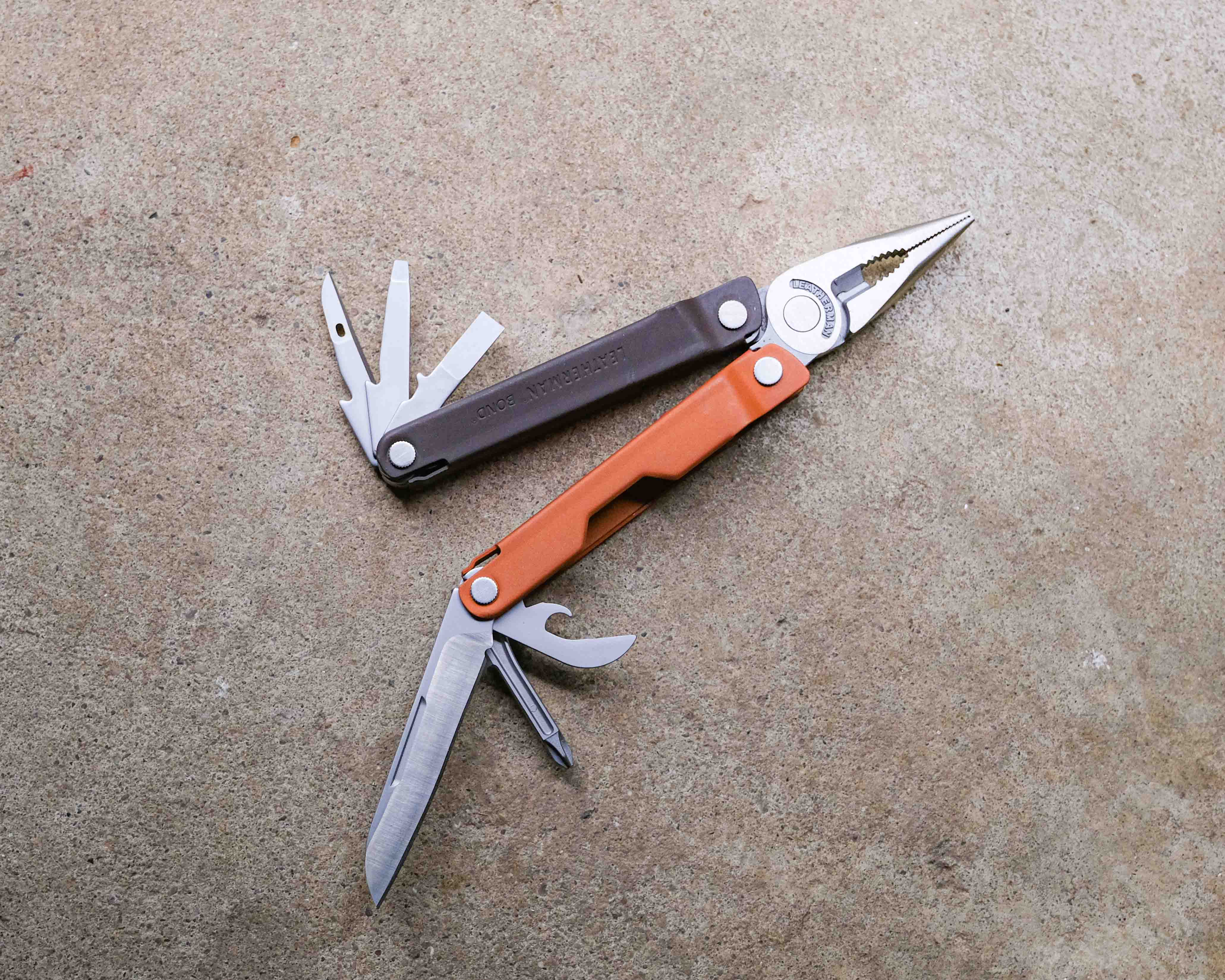 Leatherman multi-tool on concrete backdrop